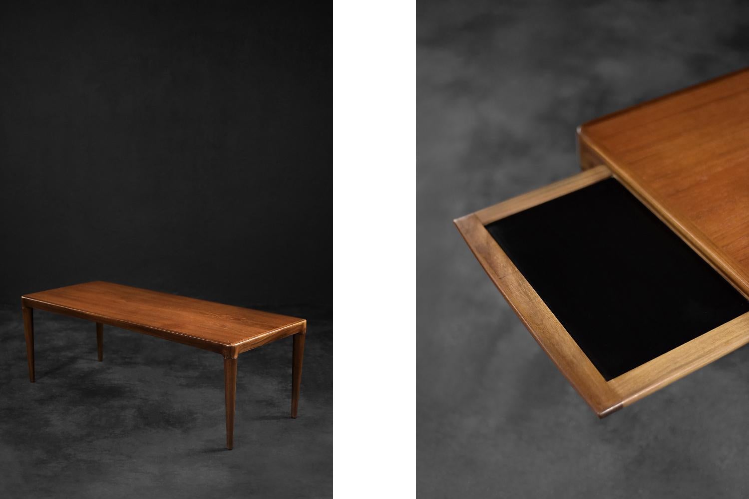 This classic low coffee table was made in Denmark during the 1960s. It is made of high-quality noble rosewood in a warm shade of brown. In contrast to the popular rosewood finishes - the offered table has regular and calm grain. The table has a pull