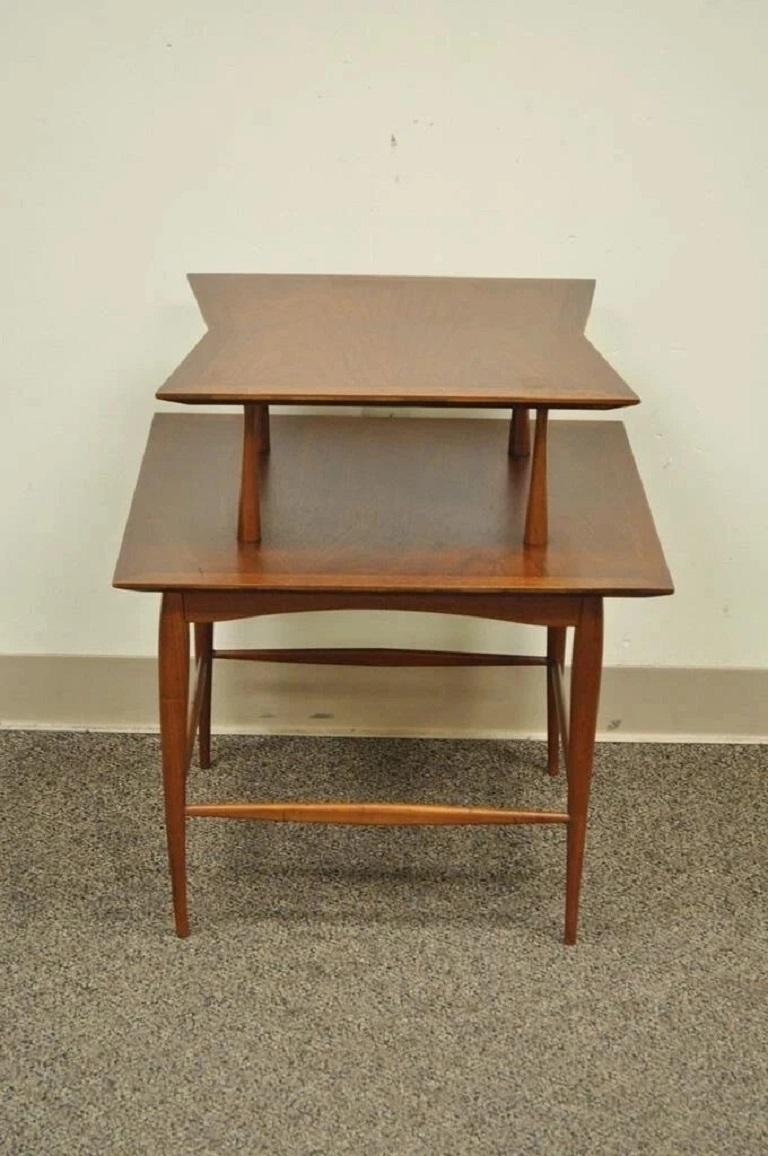 Vintage Mid Century Danish Modern Sculpted Walnut 2 Tier Side Table with Sleek Tapered Legs. Circa Mid 20th Century. Measurements: 25