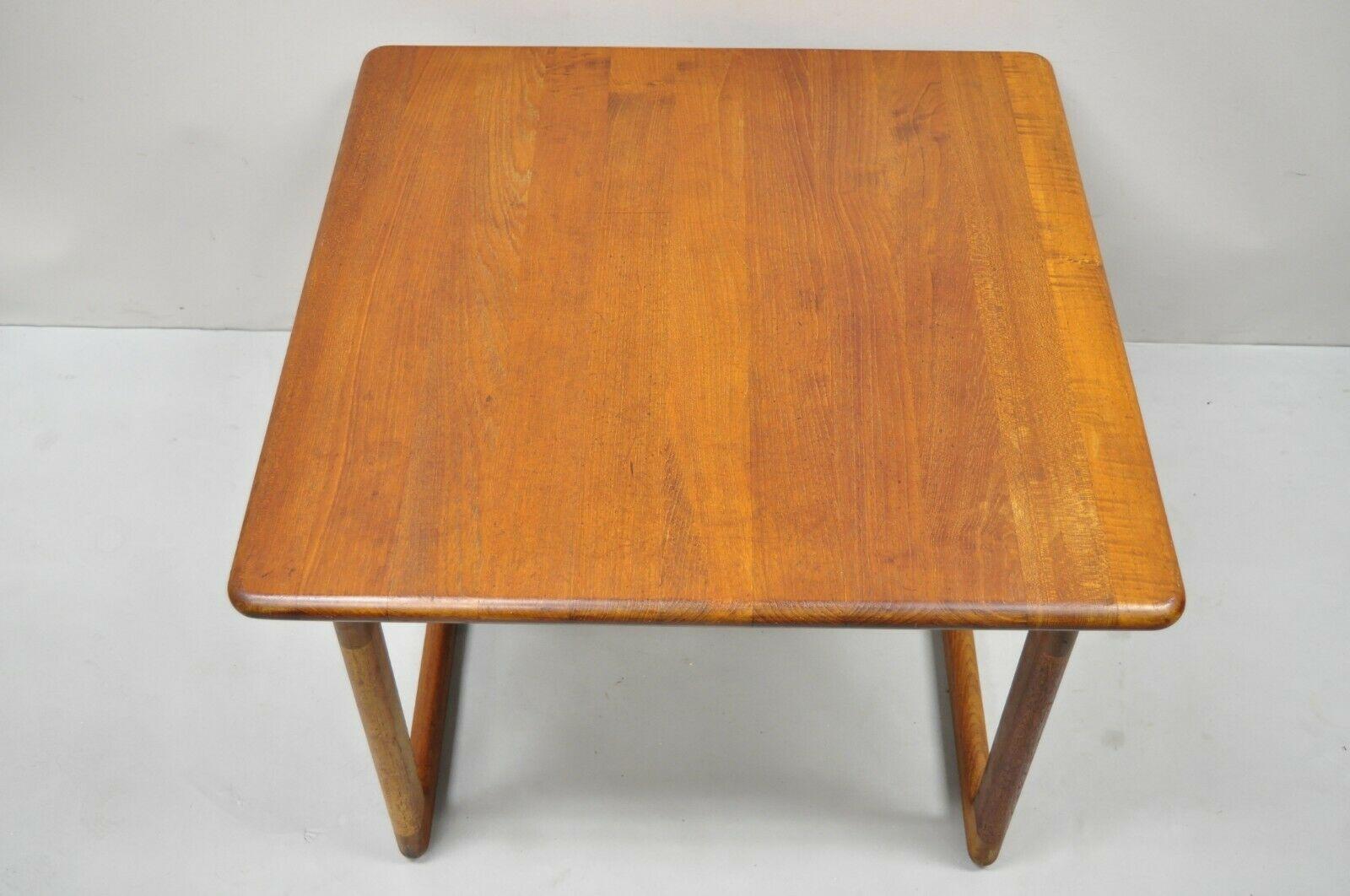Vintage Mid Century Danish Modern Teak Wood Square Side End Table. Item features a stretcher base, solid wood construction, beautiful wood grain, original Denmark stamp, clean Modernist lines, great style and form. Circa Mid 20th Century.