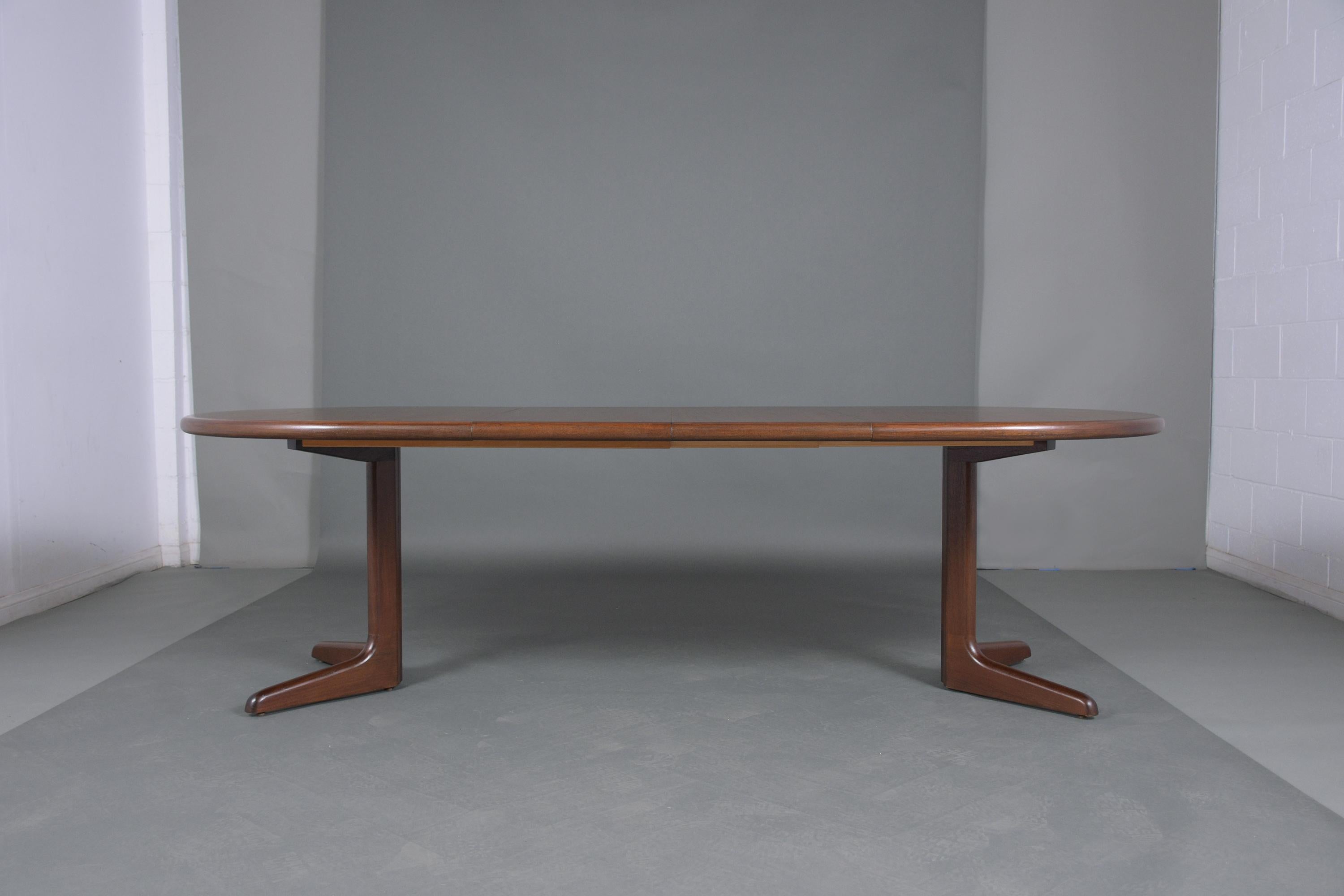 This Danish Mid-Century Modern dining table has been newly restored, is made out of teak wood, and has its natural walnut stain finish with a newly lacquered finish. This oval top table comes with two extra leaves that can be added/ removed with