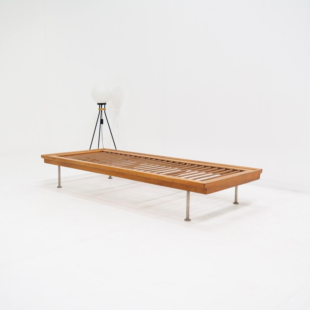 Beautiful vintage Mid-century daybed with clear lines. It was probably manufactured in Germany and dates from the 1950s.

The bed is still in very good condition with all springs intact. There is some normal wear and tear on the wood, and legs,