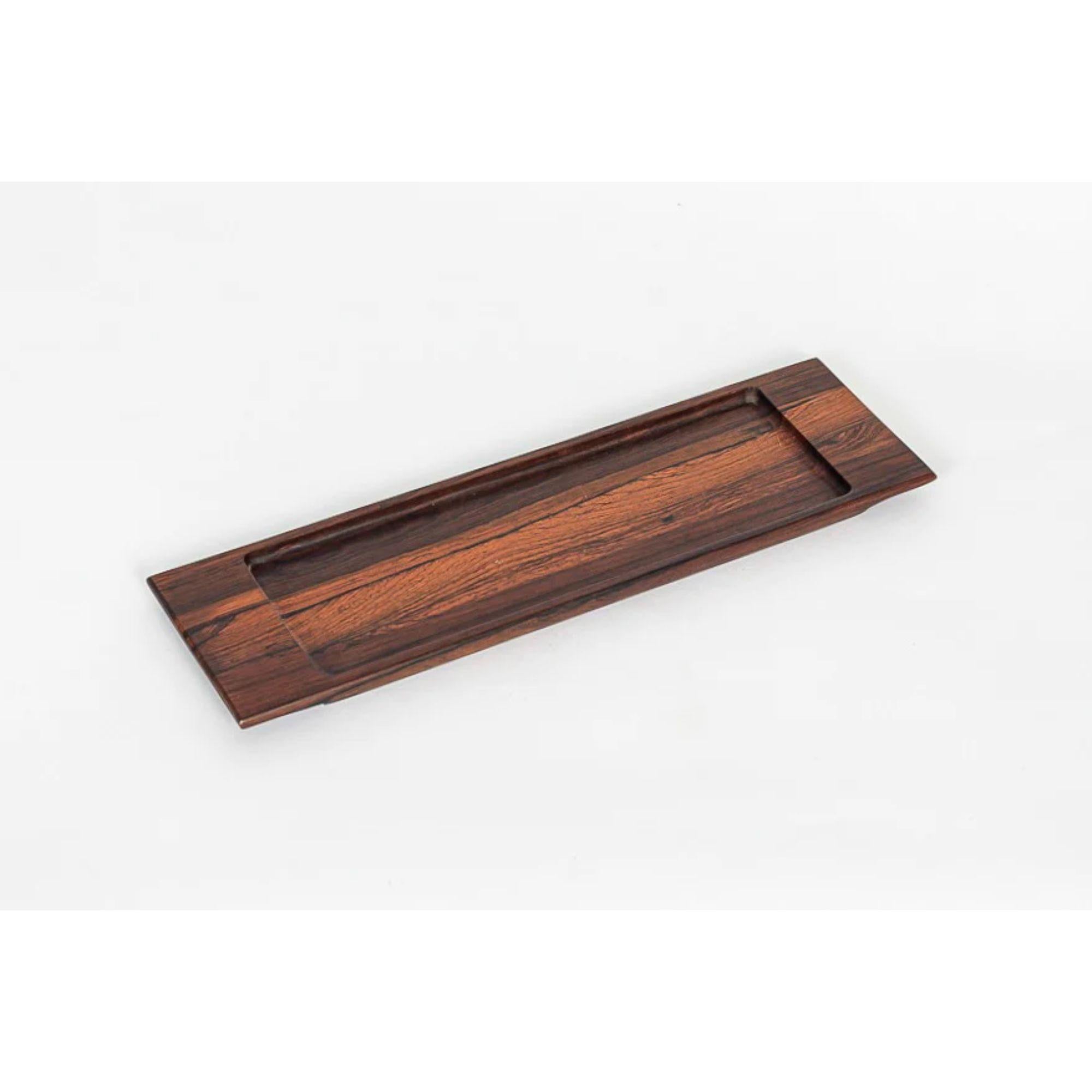 This midcentury Brazilian modern rosewood decorative tray was designed by Jean Gillon for WoodArt and made in Brazil circa 1960. Impeccably handcrafted from hard Jacaranda rosewood native to Brazil, a signature material of Gillon design, this tray