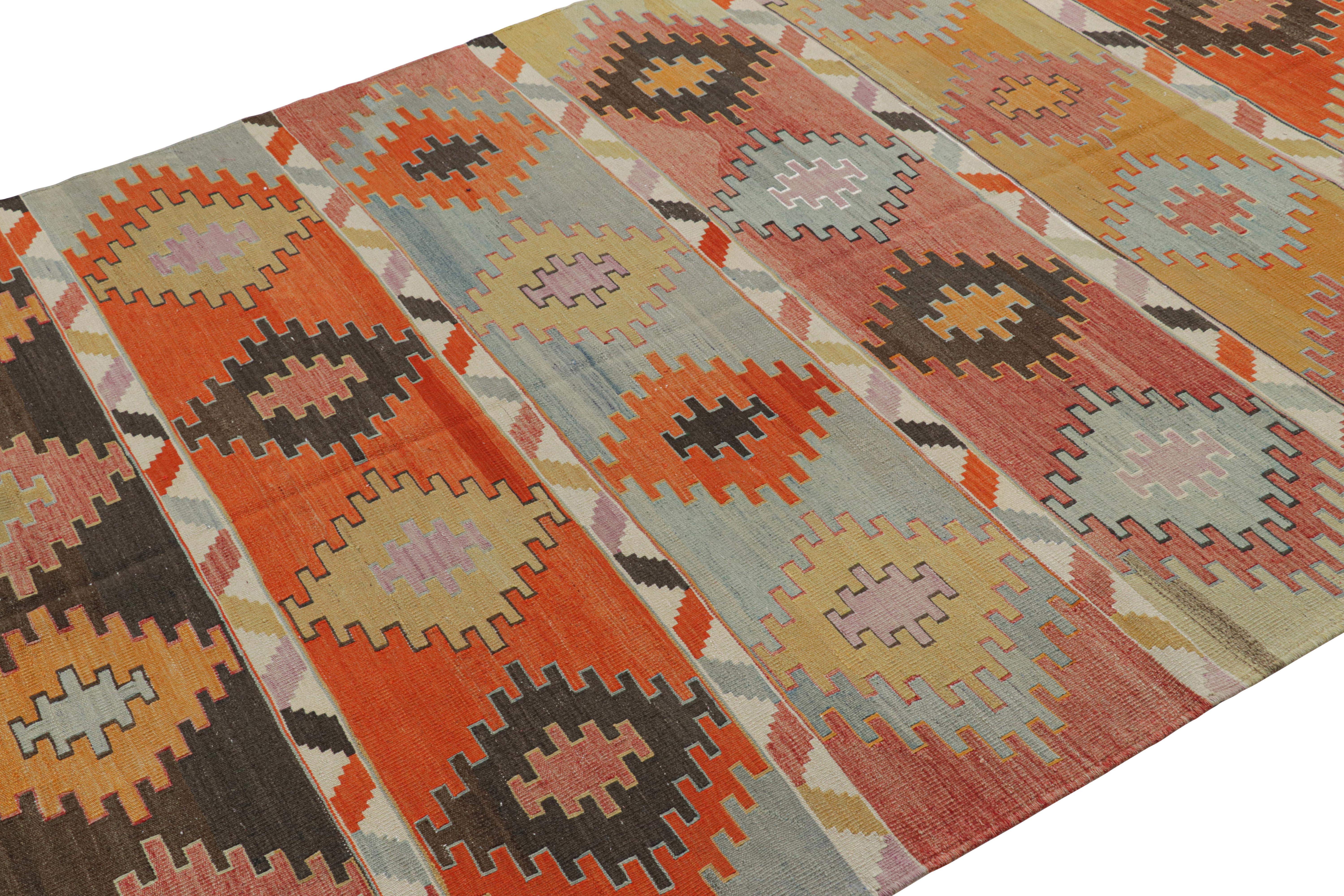 Handwoven in Turkey originating between 1950-1960, this vintage midcentury 6 x 11 wool Kilim hails from the Sivas province, a widely regarded locale of acclaimed Central Anatolian rarities. The lack of exact repetition in the rows of bright and