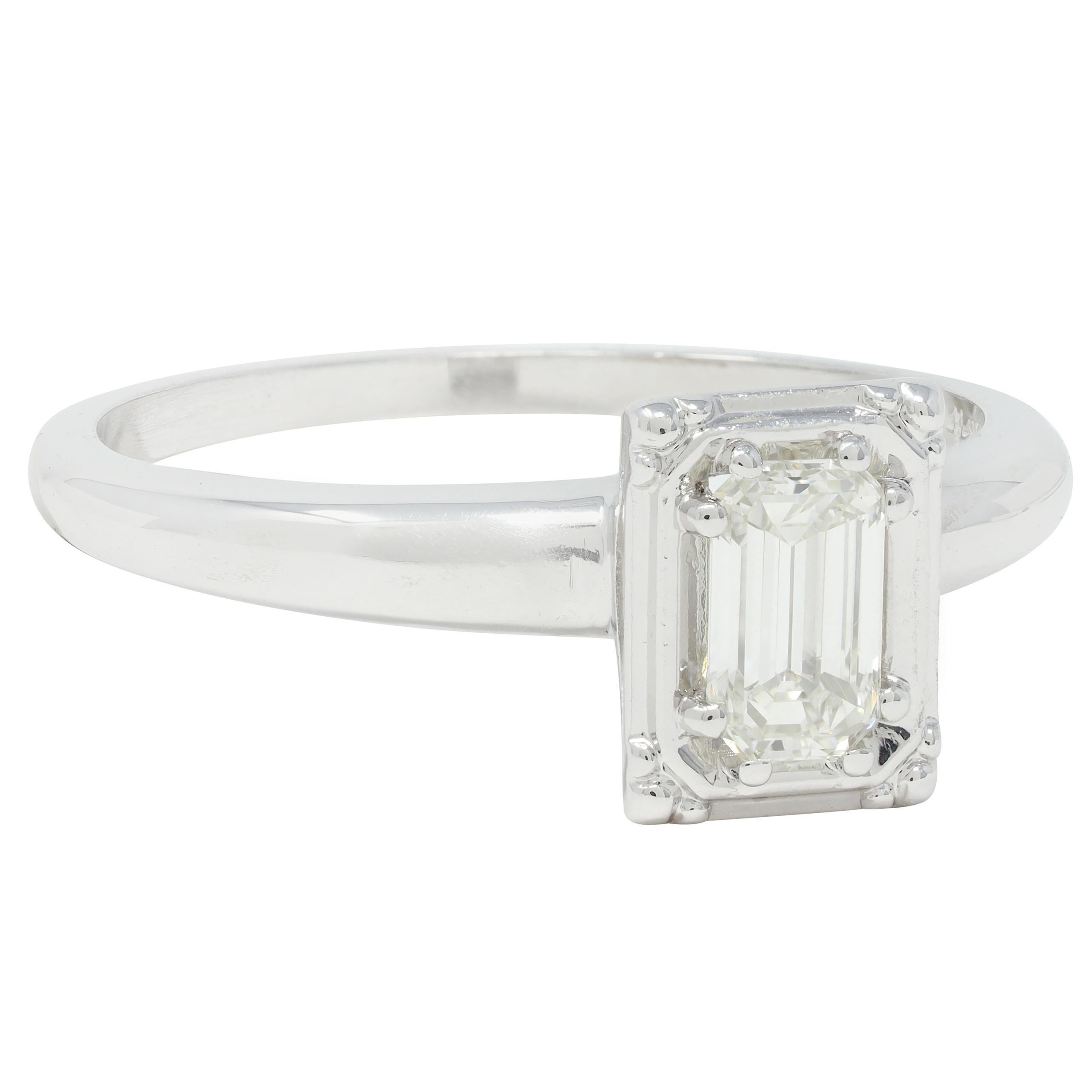 Centering an emerald cut diamond weighing approximately 0.40 carat total - J color with VS2 clarity
Bead set in an octagonal form head with a pierced arch motif basket
Completed by tapered shank with high polish finish
Stamped for 14 karat