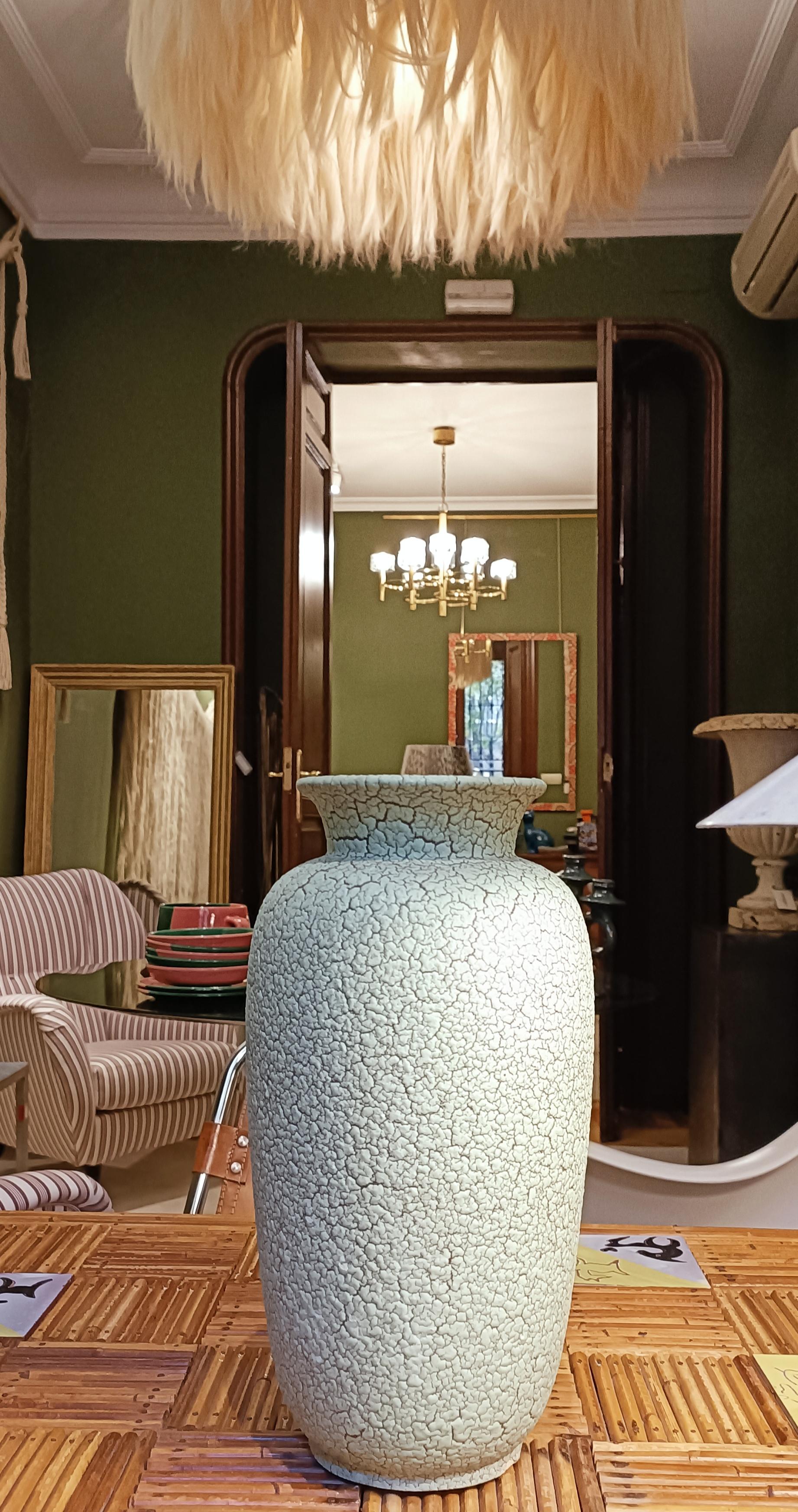 This Jasba Ceramics piece, hand-produced in West Germany circa the 1950s, features a distinctive aquamarine color shade complemented by the timeless classical cracked Cortina décor glaze. The unique aquamarine hue and cracked glaze finish create a