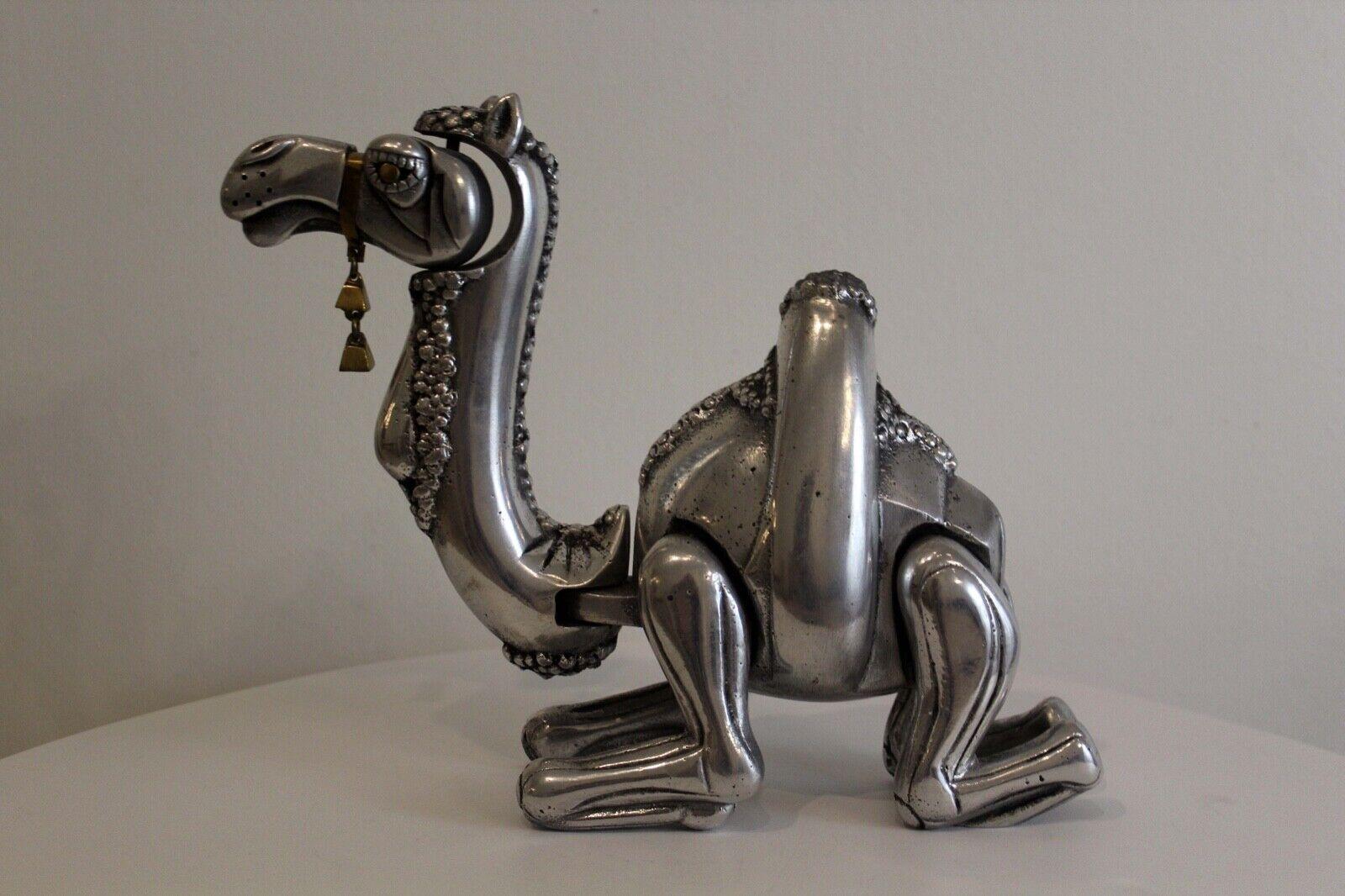 For your consideration is this cool chrome Frank Meisler adjustable camel sculpture, made in Israel, hand signed, number 72/280. Dimensions: 11W x 3D x 8H.
 