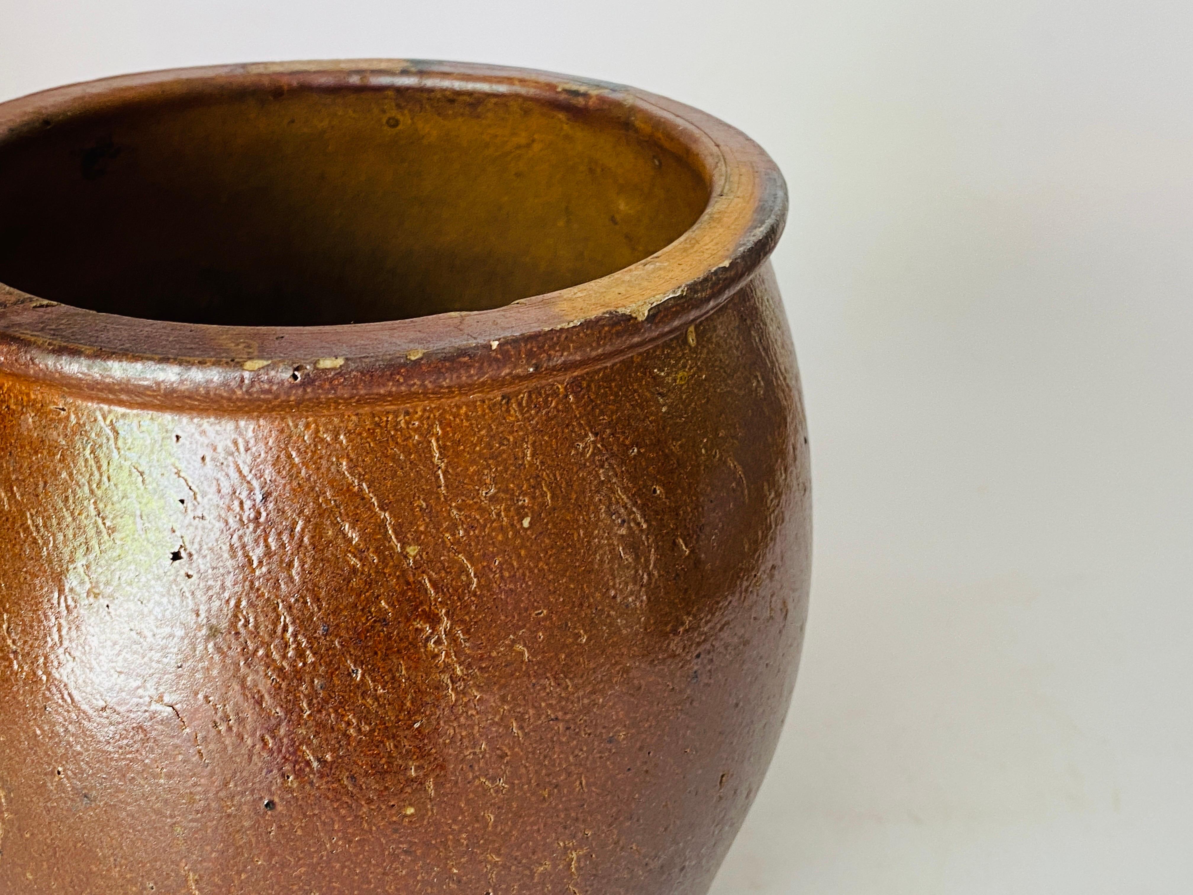 This Jar is in sandstone, in brown color. It has been done in the south of France. 
The datation is 20th century.