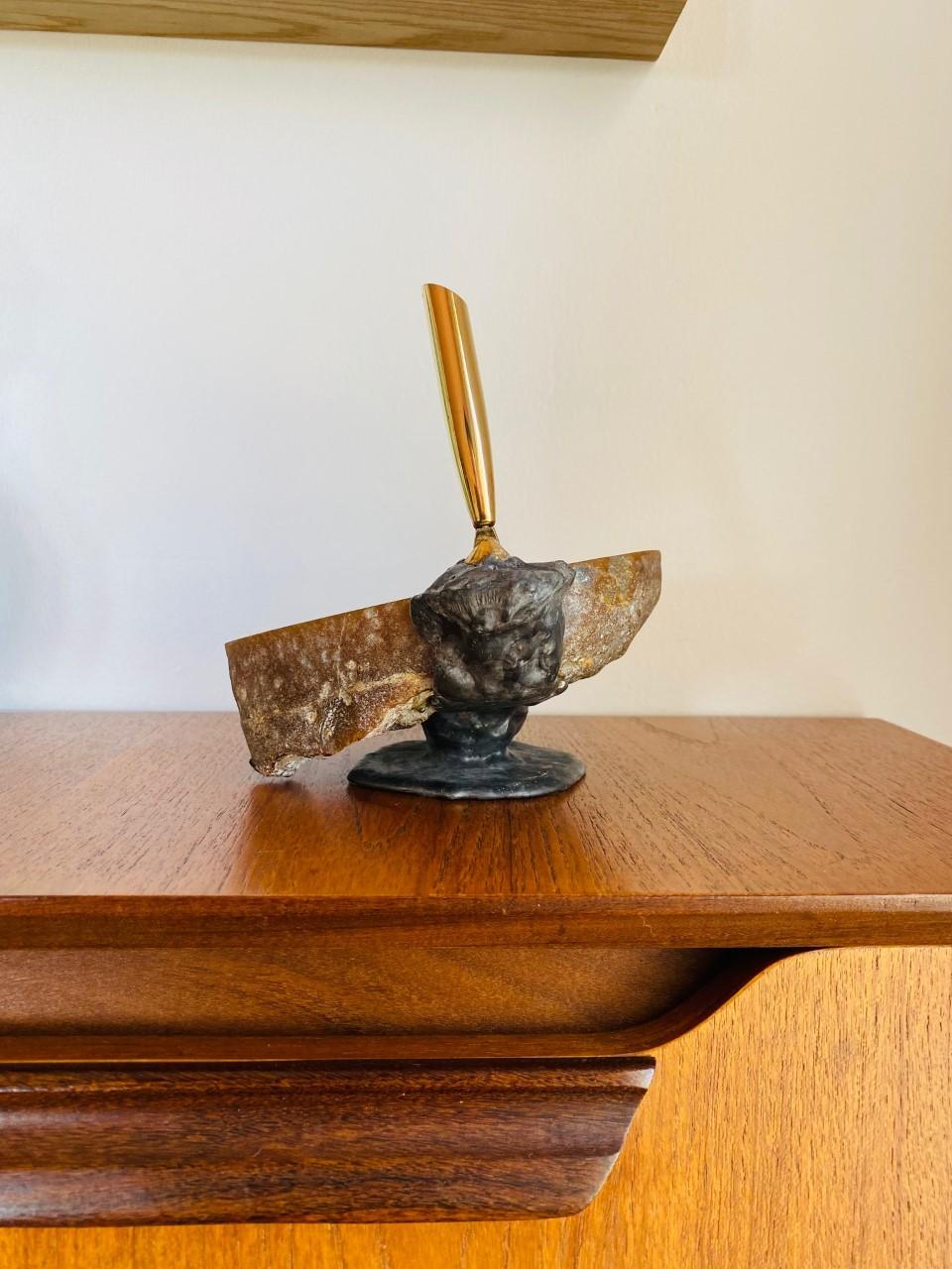Incredible and unique vintage piece. This piece brings its natural elements to sculptural statues. Raw bronze is artistically handled to form a base that then is encrusted into a geode fragment. A pen holder base is then attached with bronze to the