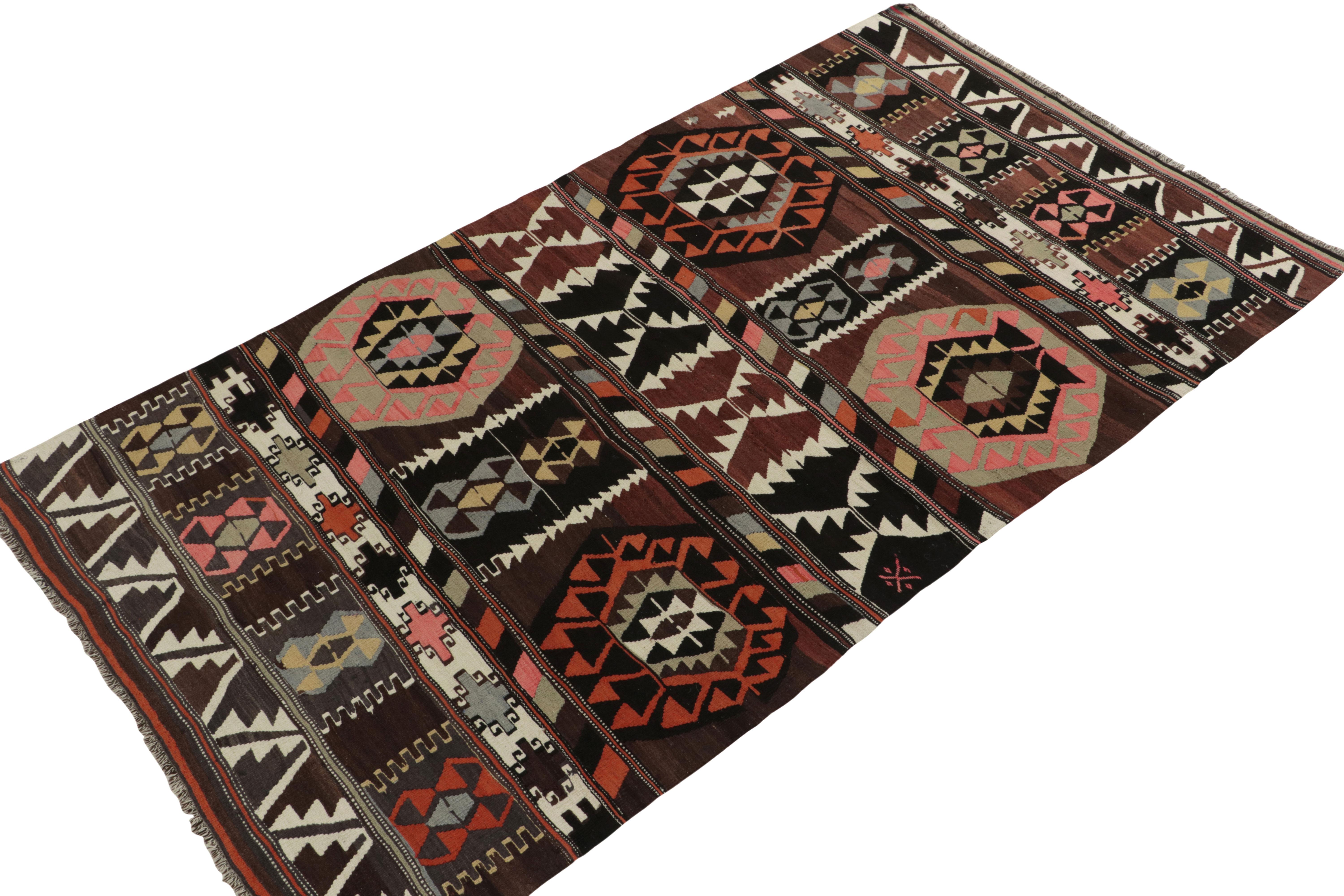 Hailing from Turkey circa 1940-1950, a mid-century kilim rug now joining Rug & Kilim’s vintage flat weave selections. The unusual graph revels in rare colorplay of blue, red, brown, pink & black rendering a one of a kind tribal attitude exemplifying