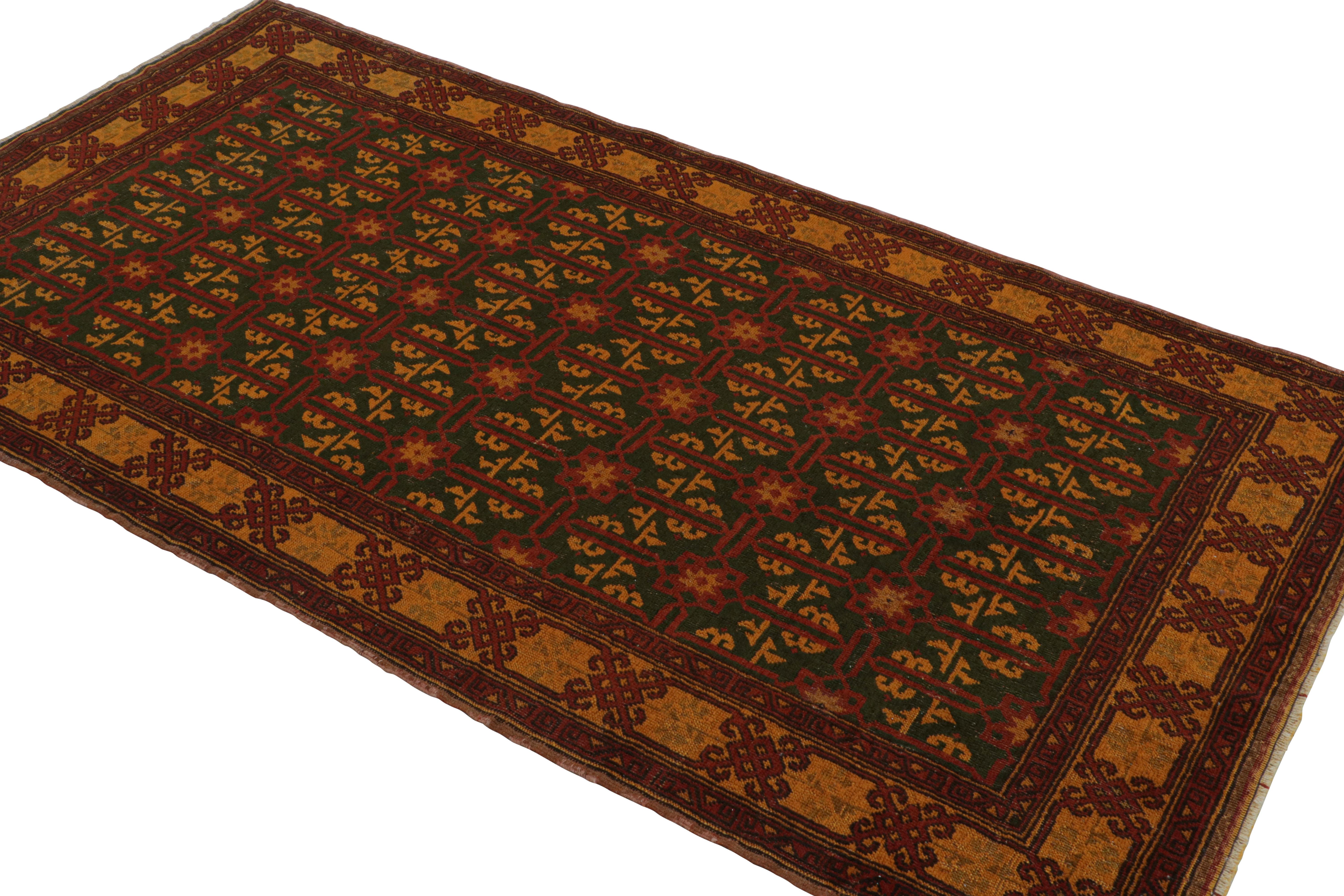 Hand-Knotted In Turkey Originating Between 1950-1960, This Vintage Mid-Century Runner Joins Rug & Kilim's Hand-Selected Rarities From The Period. This Piece Is Unique Among The Collection For A Bold Marriage Of Rich Crimson Red, Green And Orange