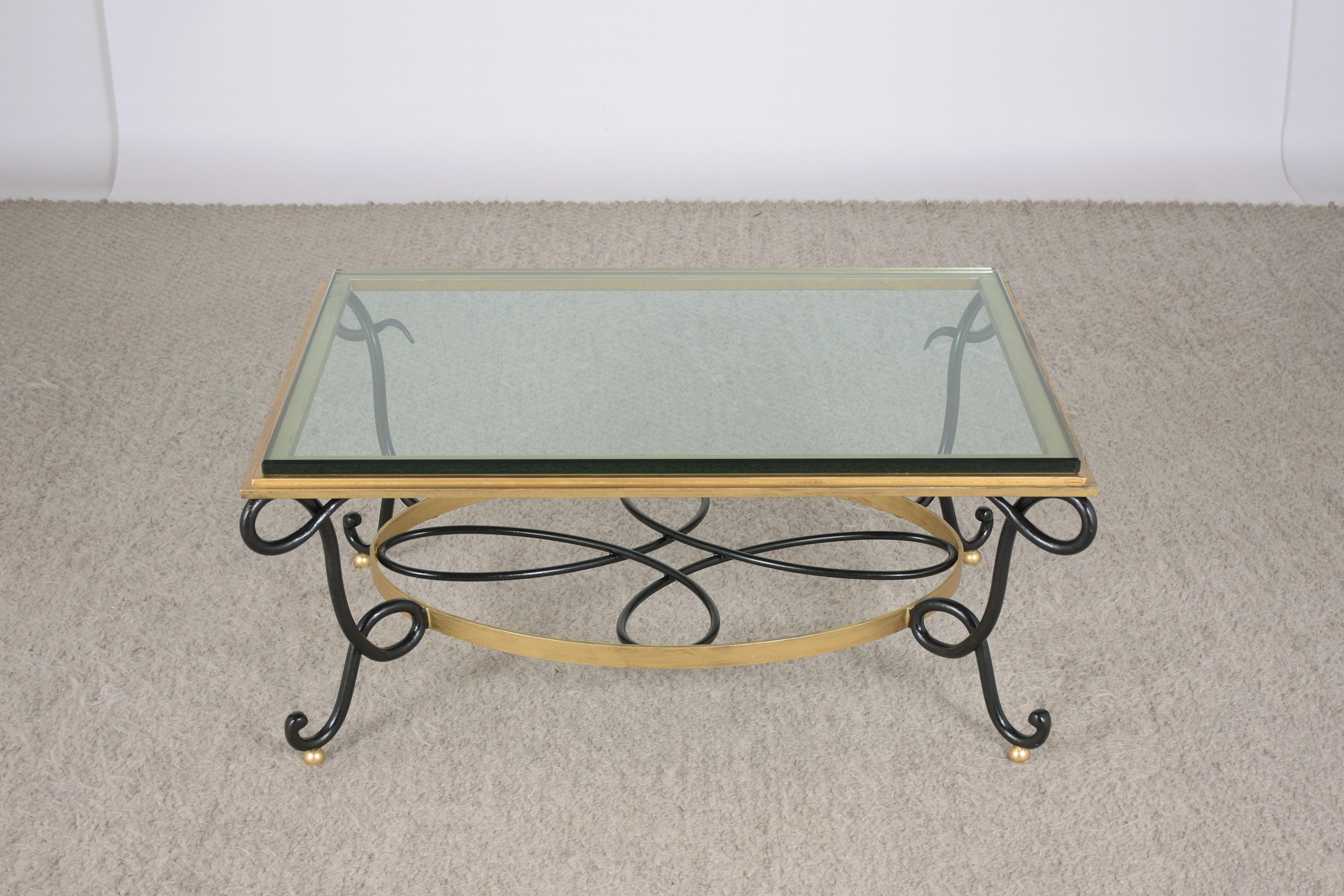 This 1960s mid-century modern iron glass top coffee table hand-crafted out of wrought iron has been newly restored by our team of expert craftsmen. The table features its original 3/4 inch thick glass top with a beveled edge and rests on a sturdy