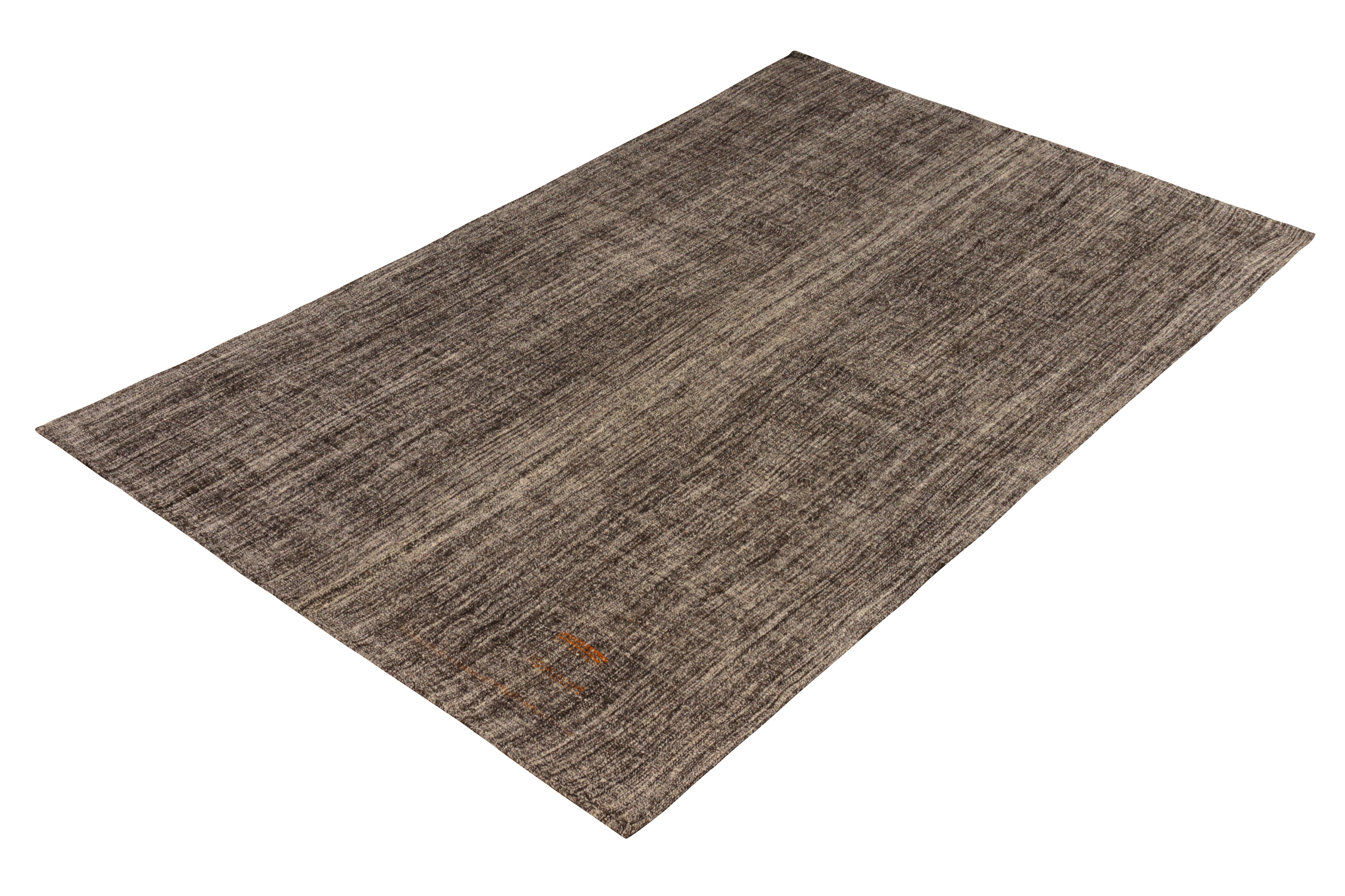 Handmade in flat-woven wool originating circa 1950-1960, this vintage Kilim rug is a transitional piece that is notably versatile in terms of its all-over stripe design applications in deep, modern colors. Relying on black and gray colorways, the