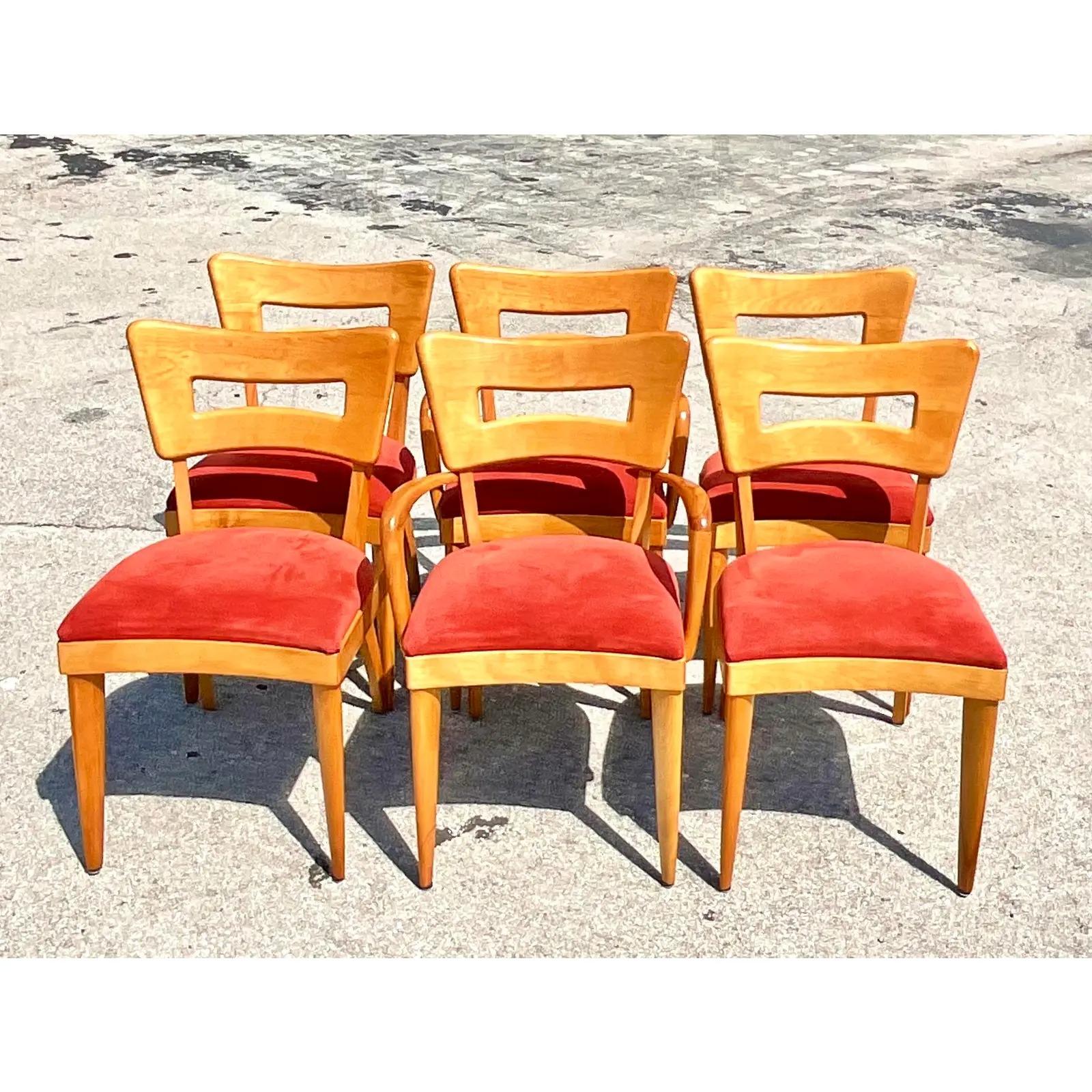 Fantastic set of six vintage MCM dining chairs. Made by the iconic Heywood Wakefield. The coveted Dog Bone design. Two arm chairs and four sides. Acquired from a Palm Beach estate.
