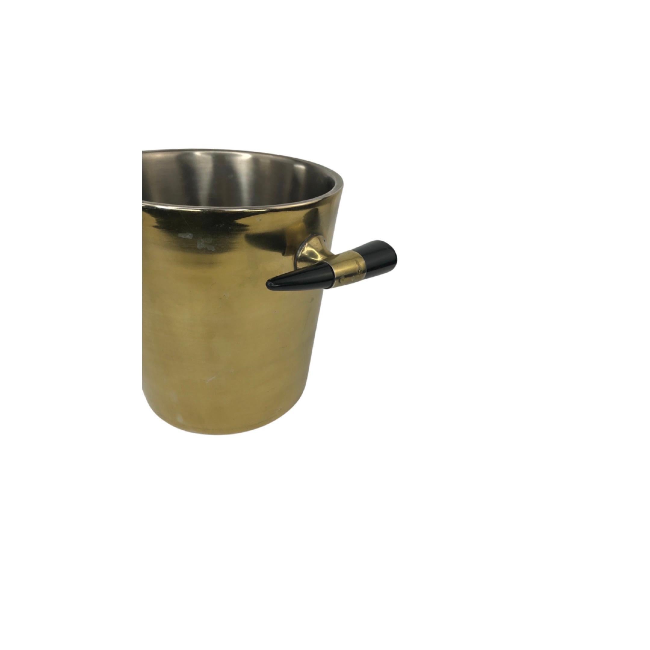 Mid Century Gold Toned Ice Bucket with Faux Horn Handles. A cool addition to your bar.
