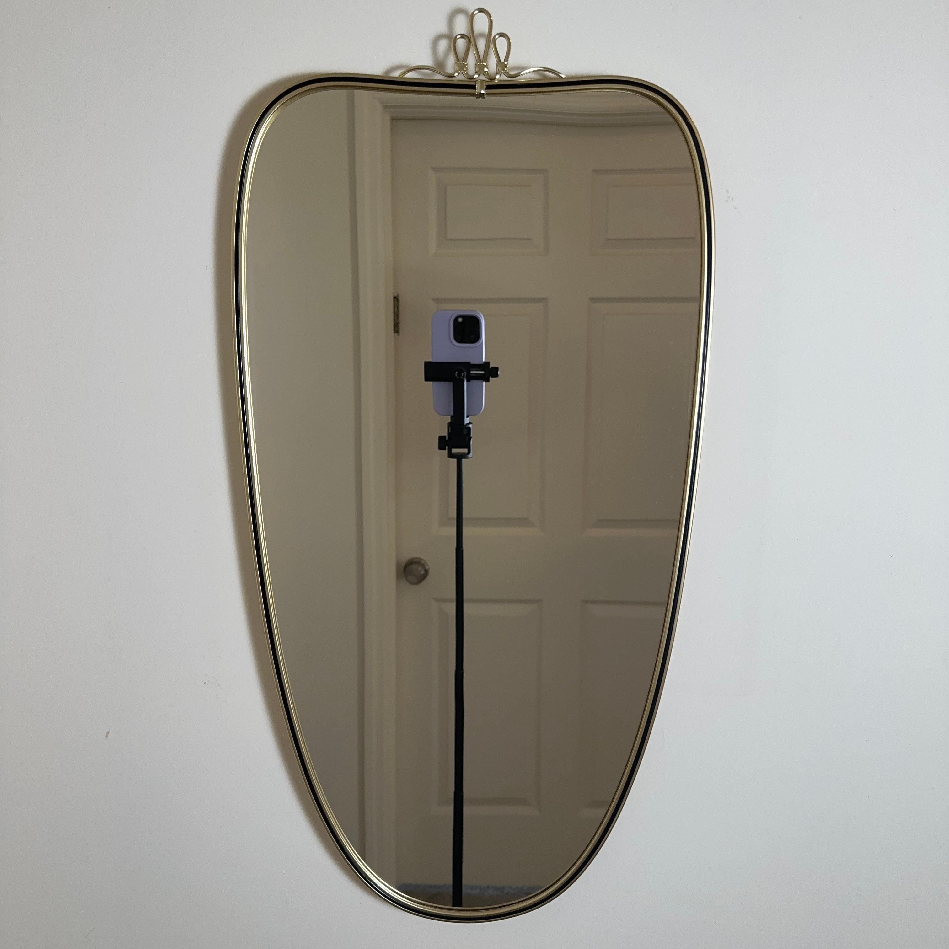 Vintage Mid Century Italian Brass & Black Shield Shape Mirror with Ribbon Detail In Good Condition In Amityville, NY