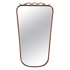 vintage shield mirror Vintage Mid Century Italian Shield Wall Mirror in Brass with Red Border Detail