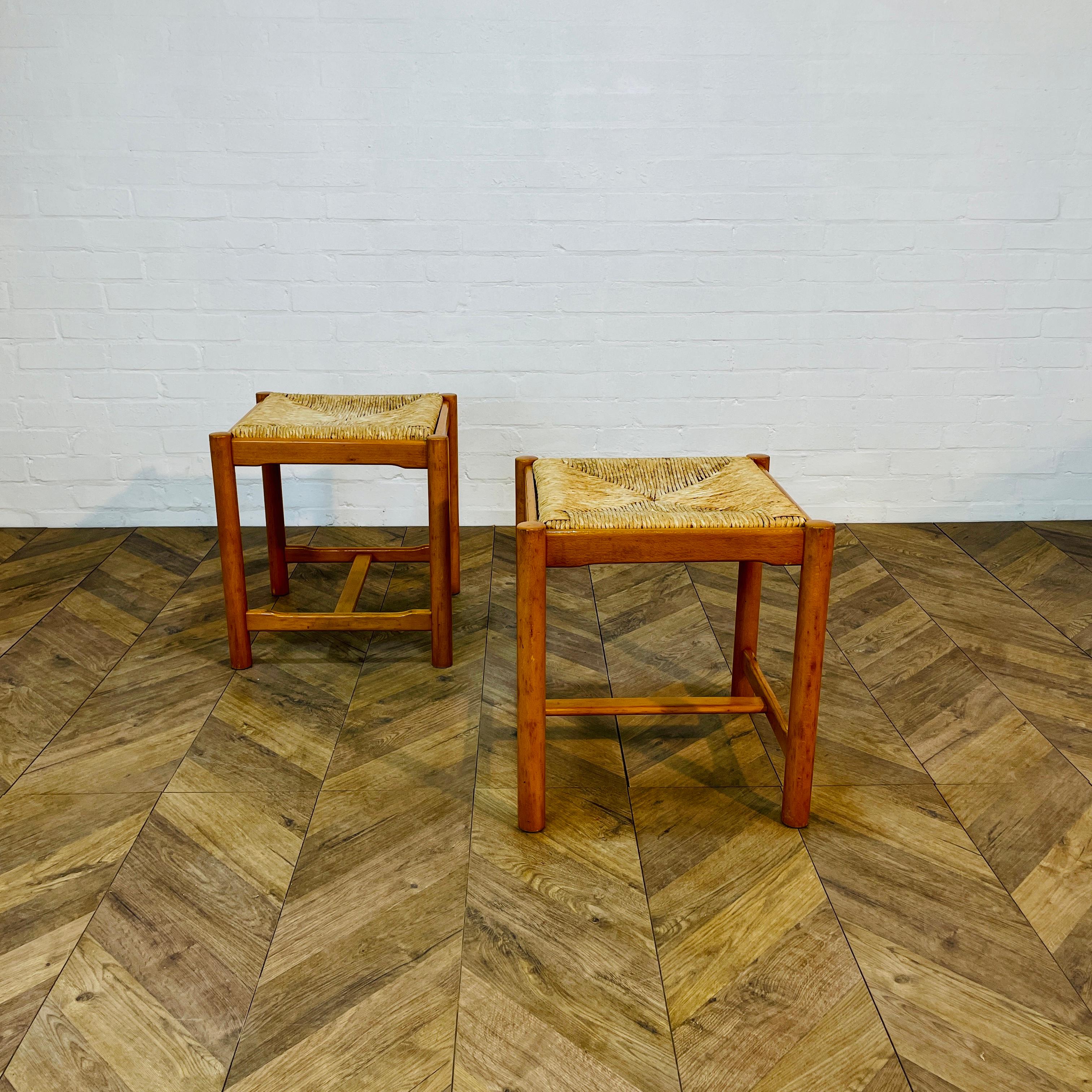 Set of 2, Italian Low Stools Attributed to Designer Vico Magistretti, circa 1970s.

The stools are made from beech with rush seats.

Structurally the stools are in very good condition, with no issues other than general wear and scuffs in-keeping