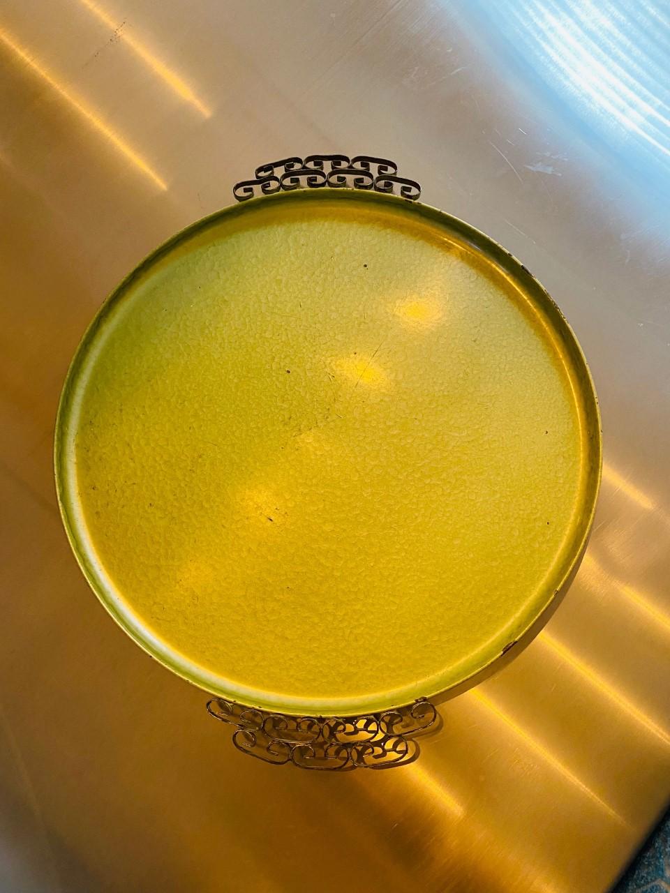 A piece of Southern California glamorous history, this vintage handmade Moire Glaze Kyes tray is composed of hammered metal with an enamel finish and double brass handles with ornate Greek key design. This beautiful piece is circular and with a