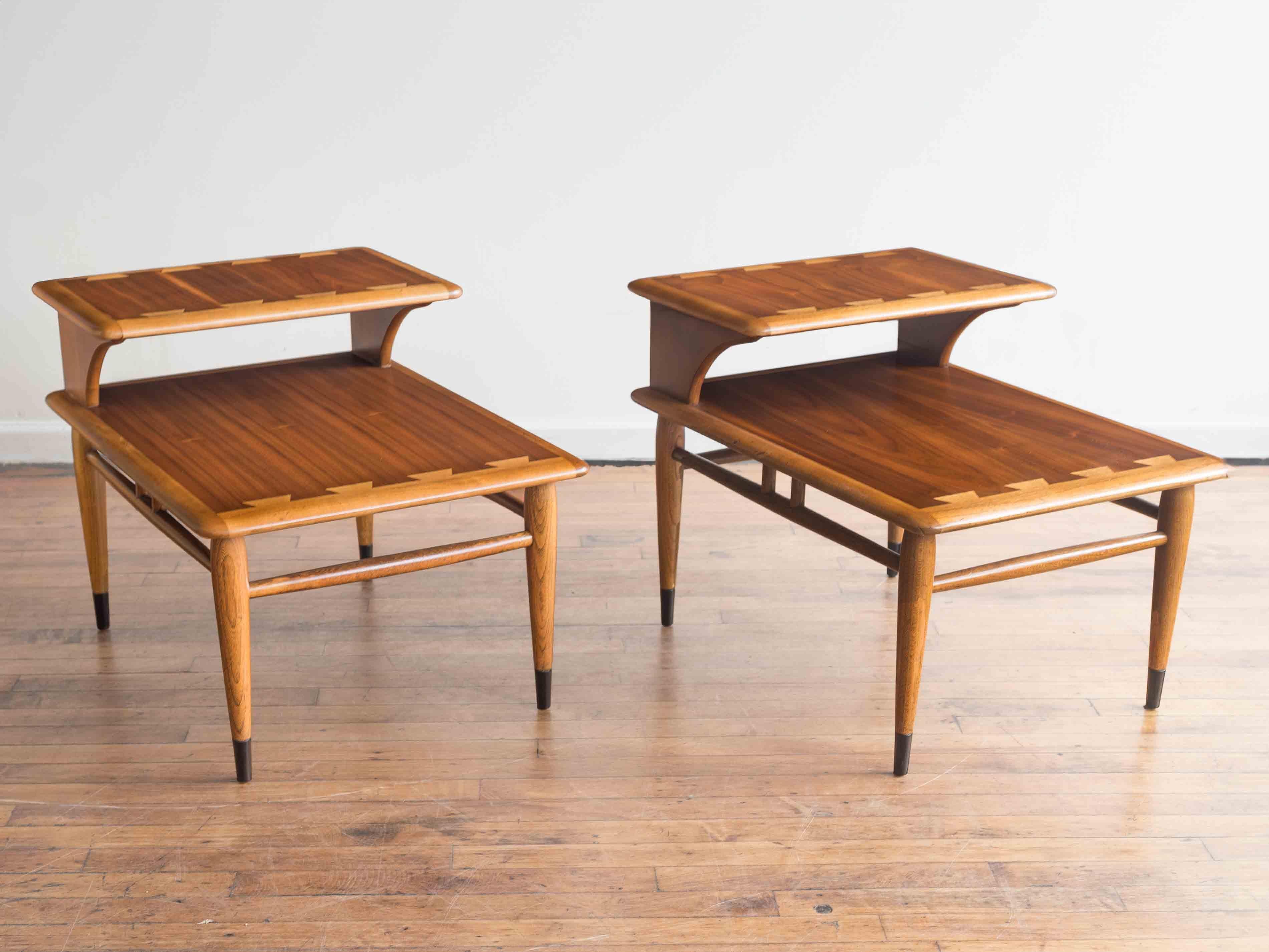 21” x 28” x 14.5”H; shelf 21”H

Pair of iconic Lane Acclaim step tables or end tables

•Elm dovetail inlays
•Walnut tops
•back shelf is 21” high
•round tapered legs accented with black lacquered tips

These are newly refinished to match their
