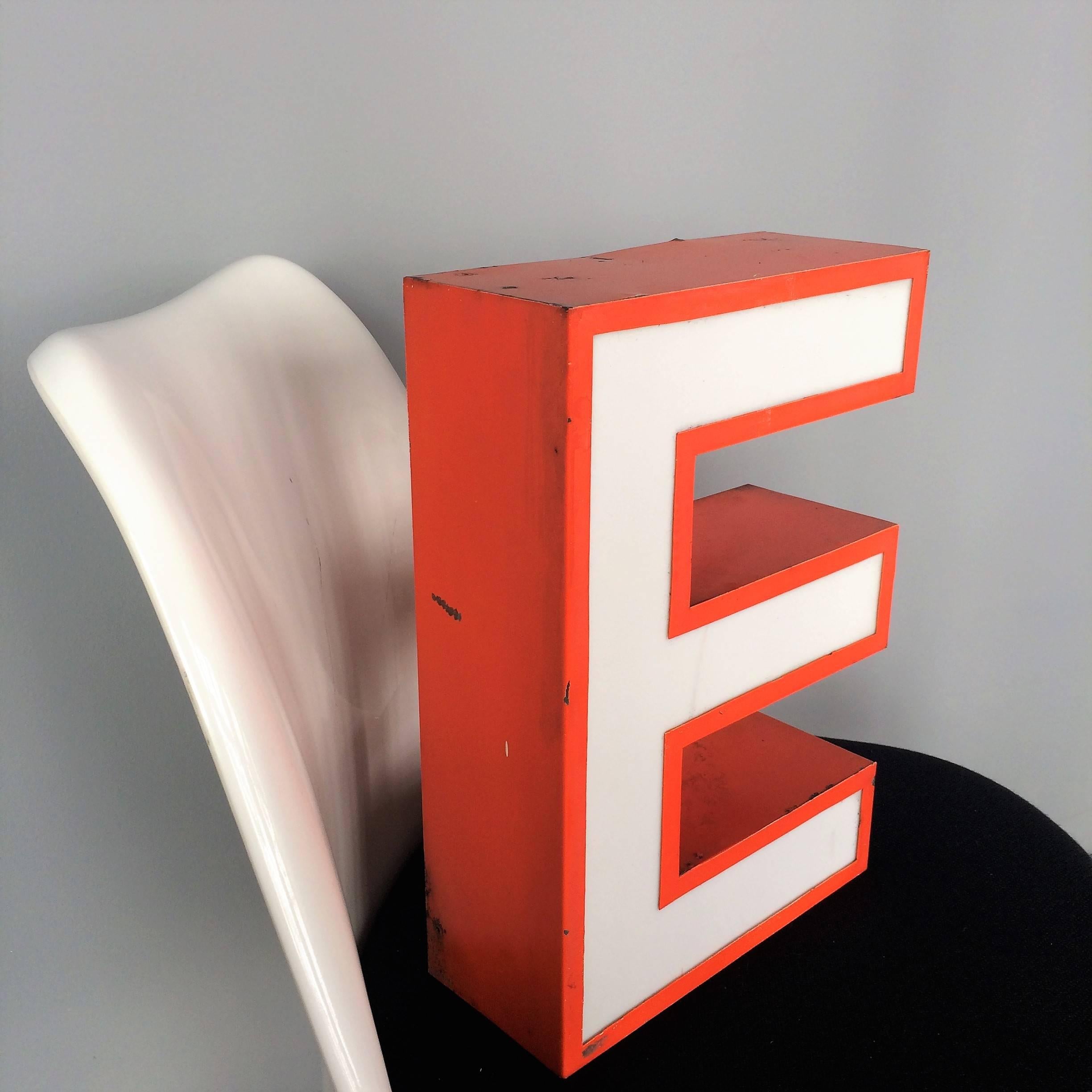 Very decorative handmade lighting letter with white acrylic glass and orange metal body. The letters create a beautifully soft, indirect light. Rewired with new cable and LED's, ready to use.

Measures: Depth 10 cm / 4 in
Height 35 cm / 14 in
Width
