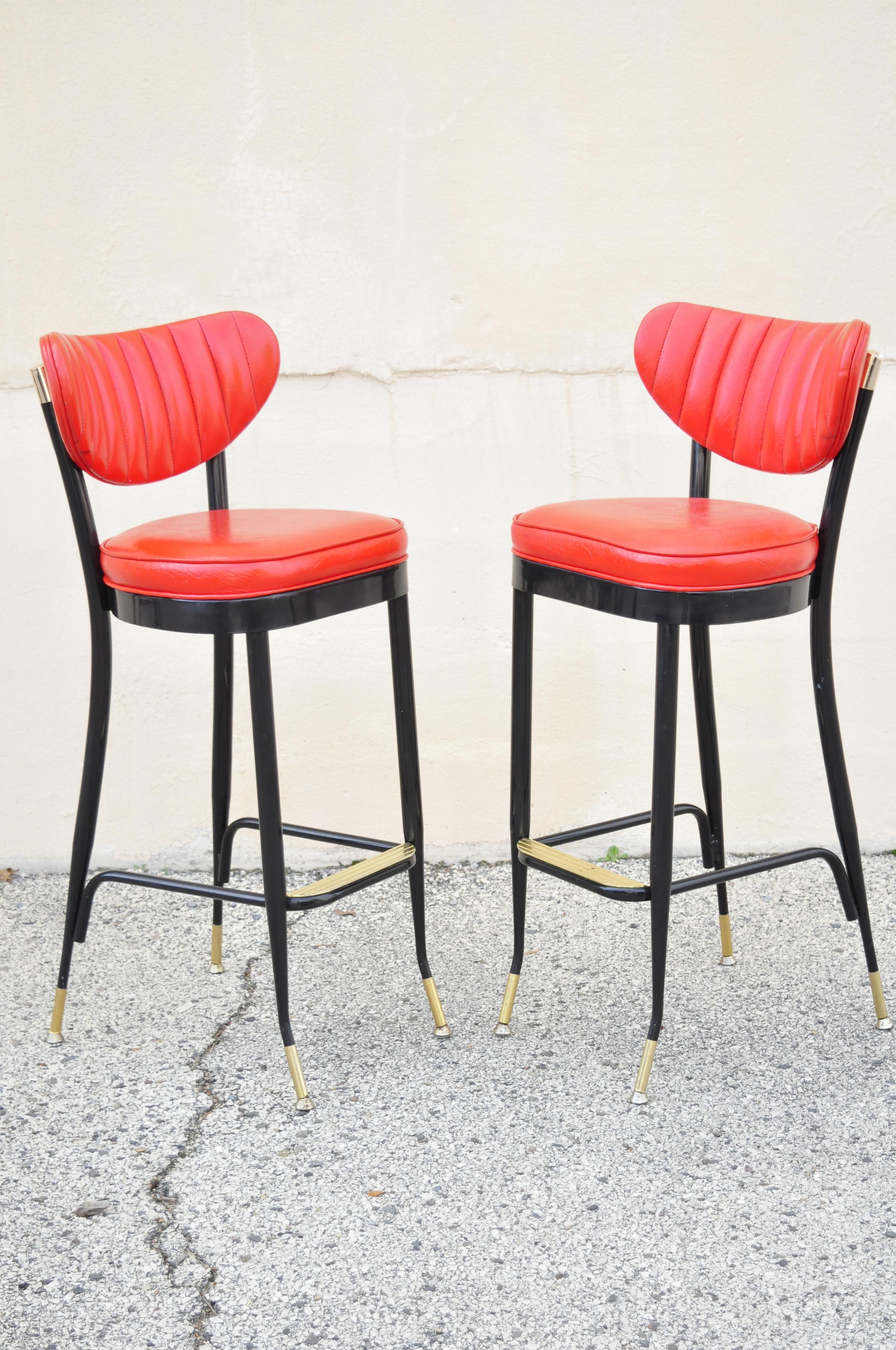 Vintage midcentury lion brand black metal red vinyl Italian style barstools, Set of 3. Item features red vinyl upholstery, metal frame, original labels, tapered legs, clean modernist lines, quality American craftsmanship, great style and form, circa
