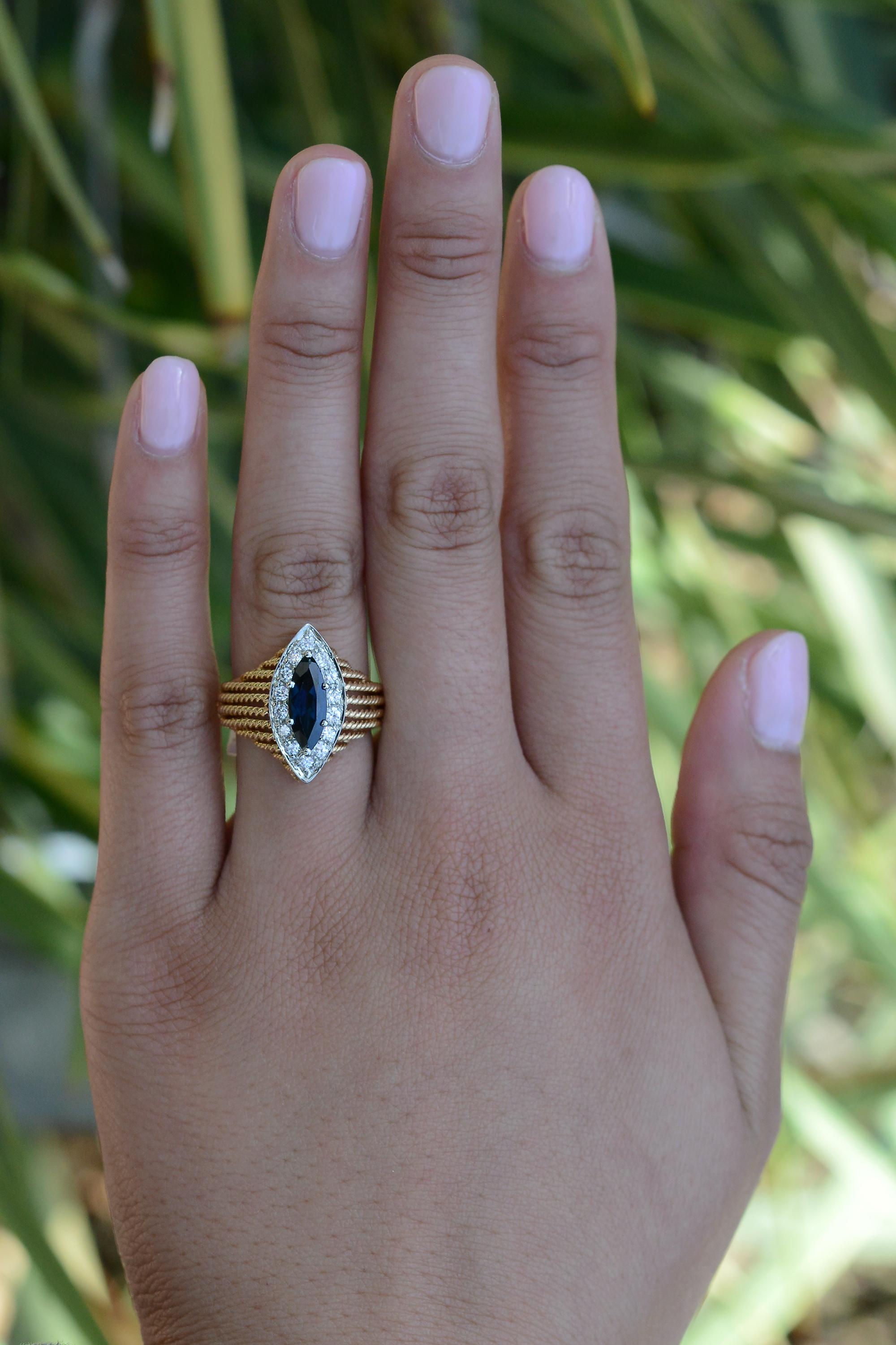 Make a sophisticated statement with this affordable vintage Mid Century cocktail engagement ring. The enchanting, elongated design features a pristine 1.17 carat natural sapphire, framed by an impressive layout of diamonds, ensuring fantastic