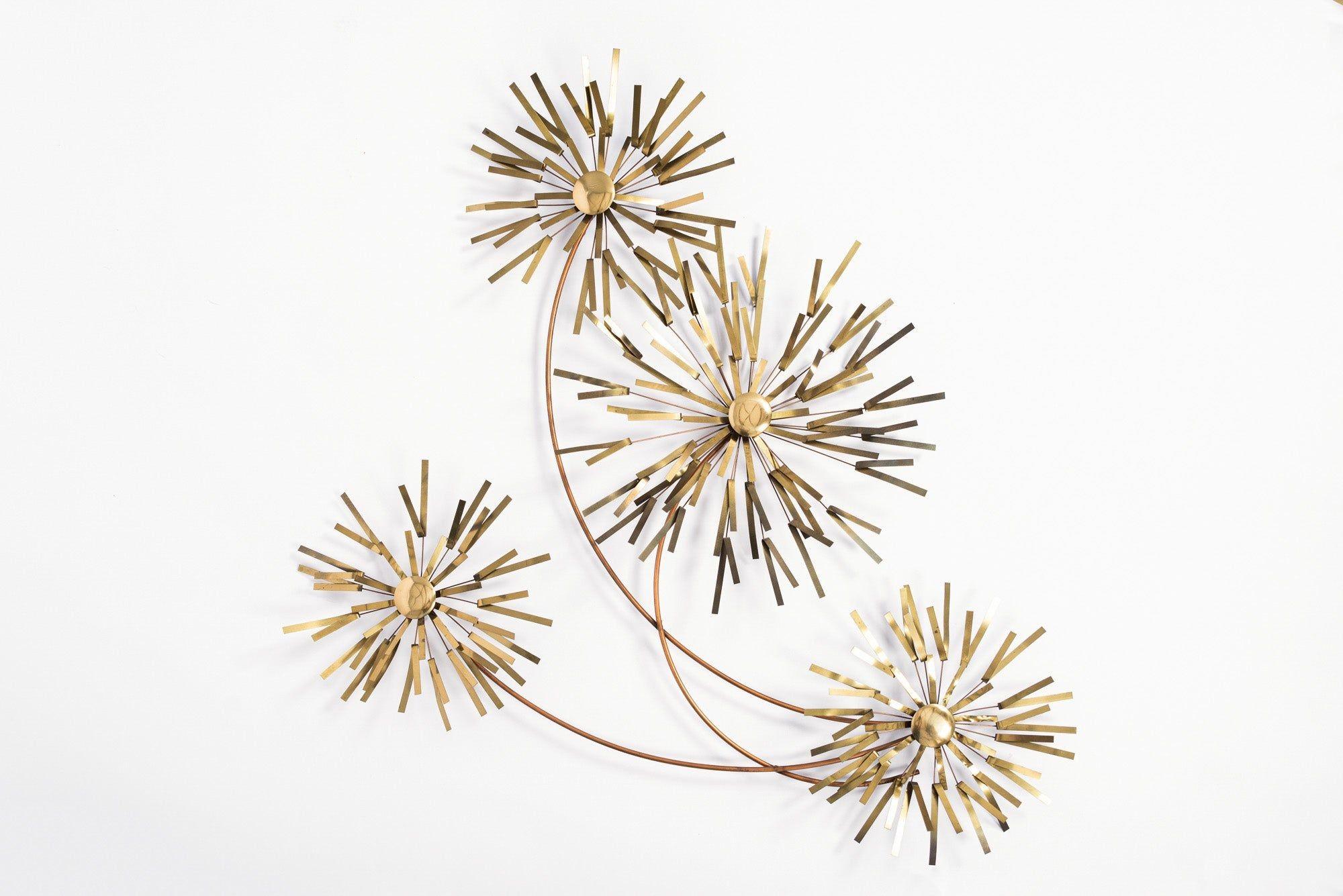 This vintage mid century modern Curtis Jere fireworks pom pom metal wall hanging features beautiful stylized round pom poms sculpted from soldered and bent brass on copper metal rods. Wall mount metal hooks are looped into the design on back. Can be