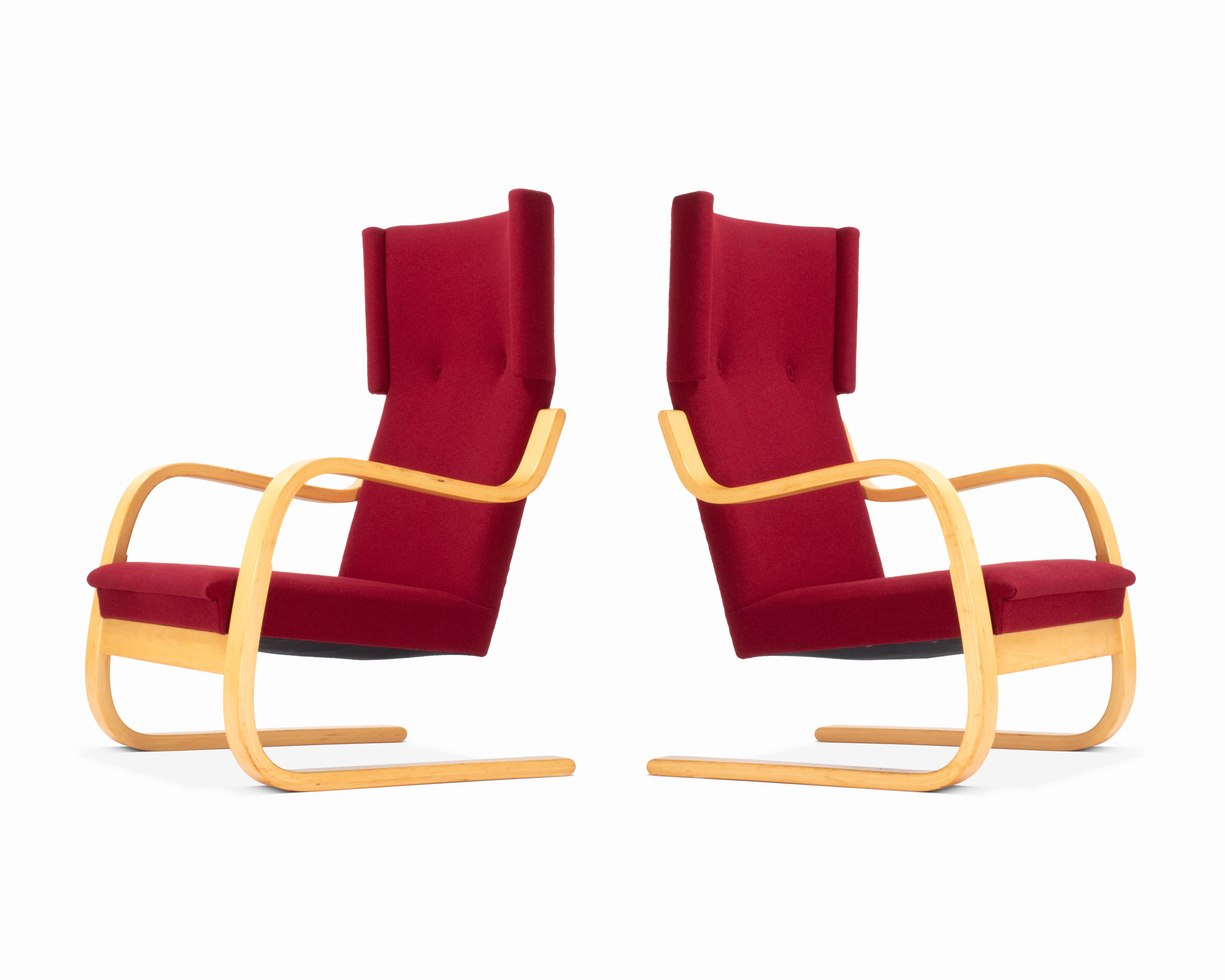 Here is a stunning pair of Alvar Aalto's Model 36/401. The wingback, cantilever design was first introduced in 1933 by Aalto following the popularity of his previous model chair. Some of the stunning details include matching/stamped armrests, spring
