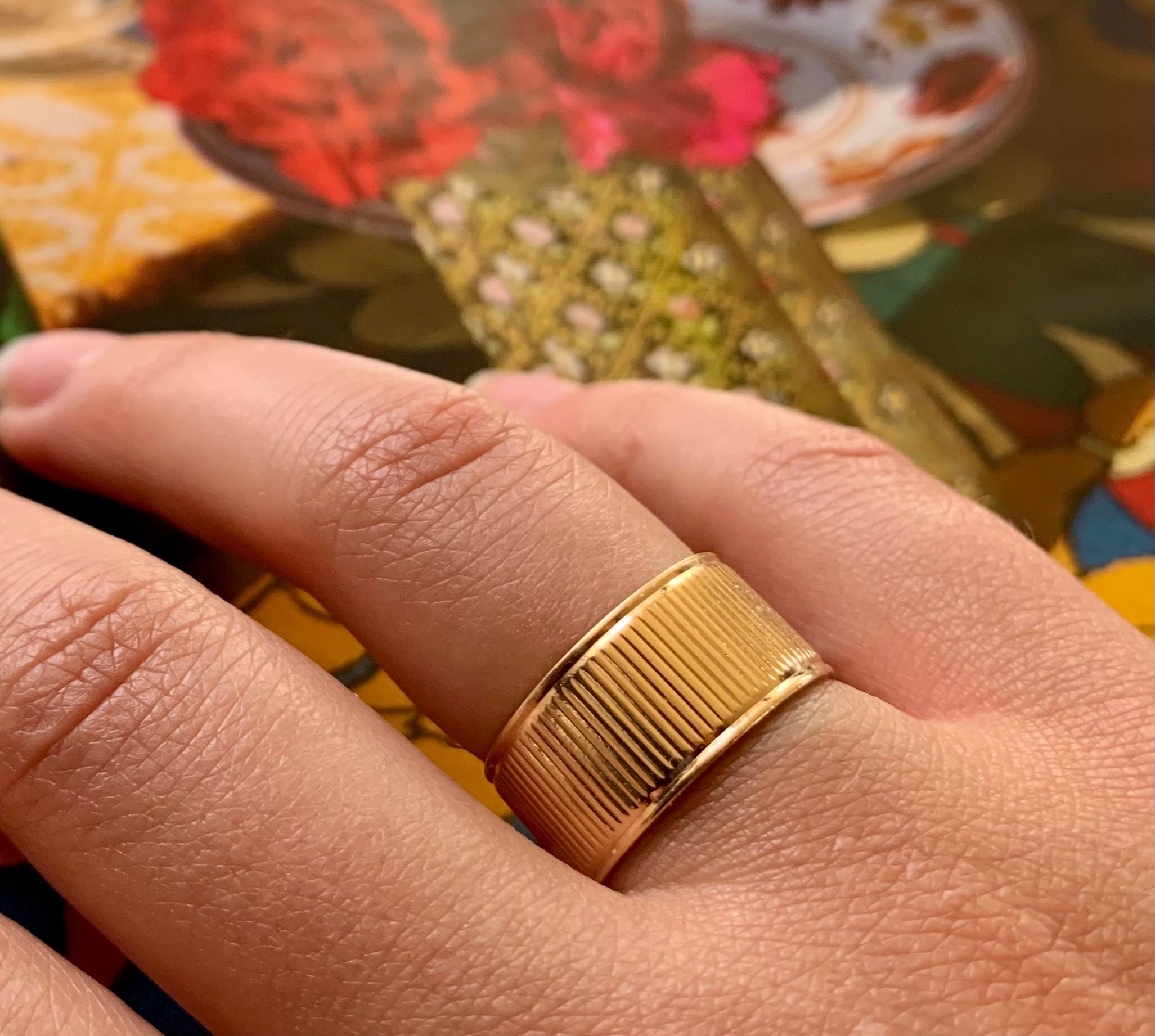 Great vintage 14K gold wide reeded classic cigar band ring. 
Very nice quality with excellent patina.
Professionally sized to continuous design.
Marks: 14K
Width of band is 9mm
Size 6US