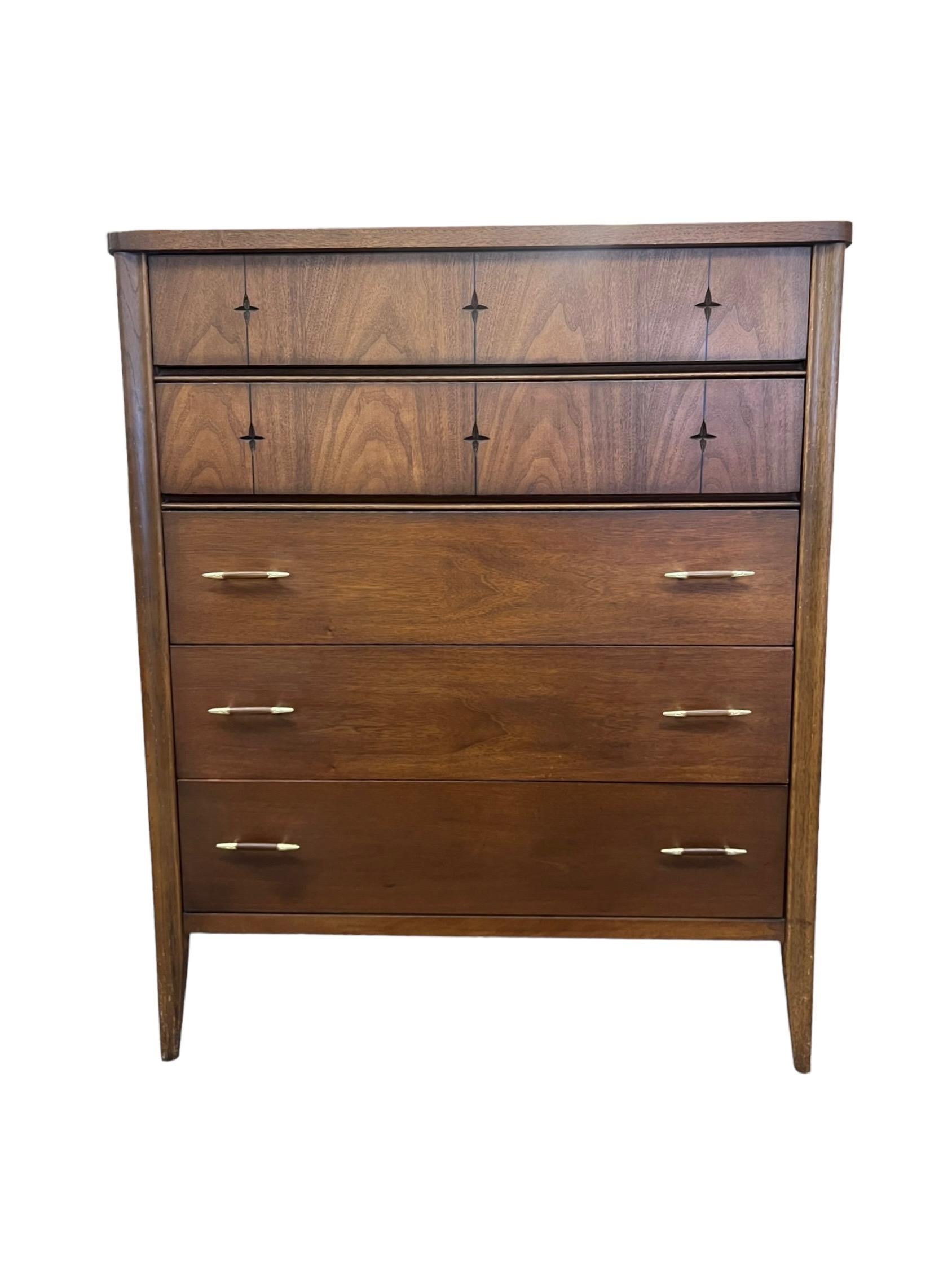 Mid century modern walnut highboy dresser with the signature 