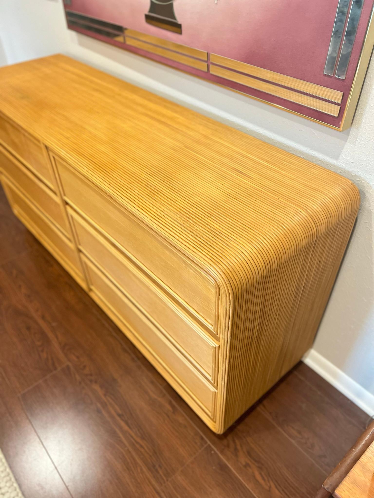 Vintage midcentury 6 drawer dresser veneered in split reed bamboo in the manner of Gabriella Crespi. 
So excited to acquire another one of these. In very good condition. All drawers open and close smoothly. Notice one small mark on the surface, it