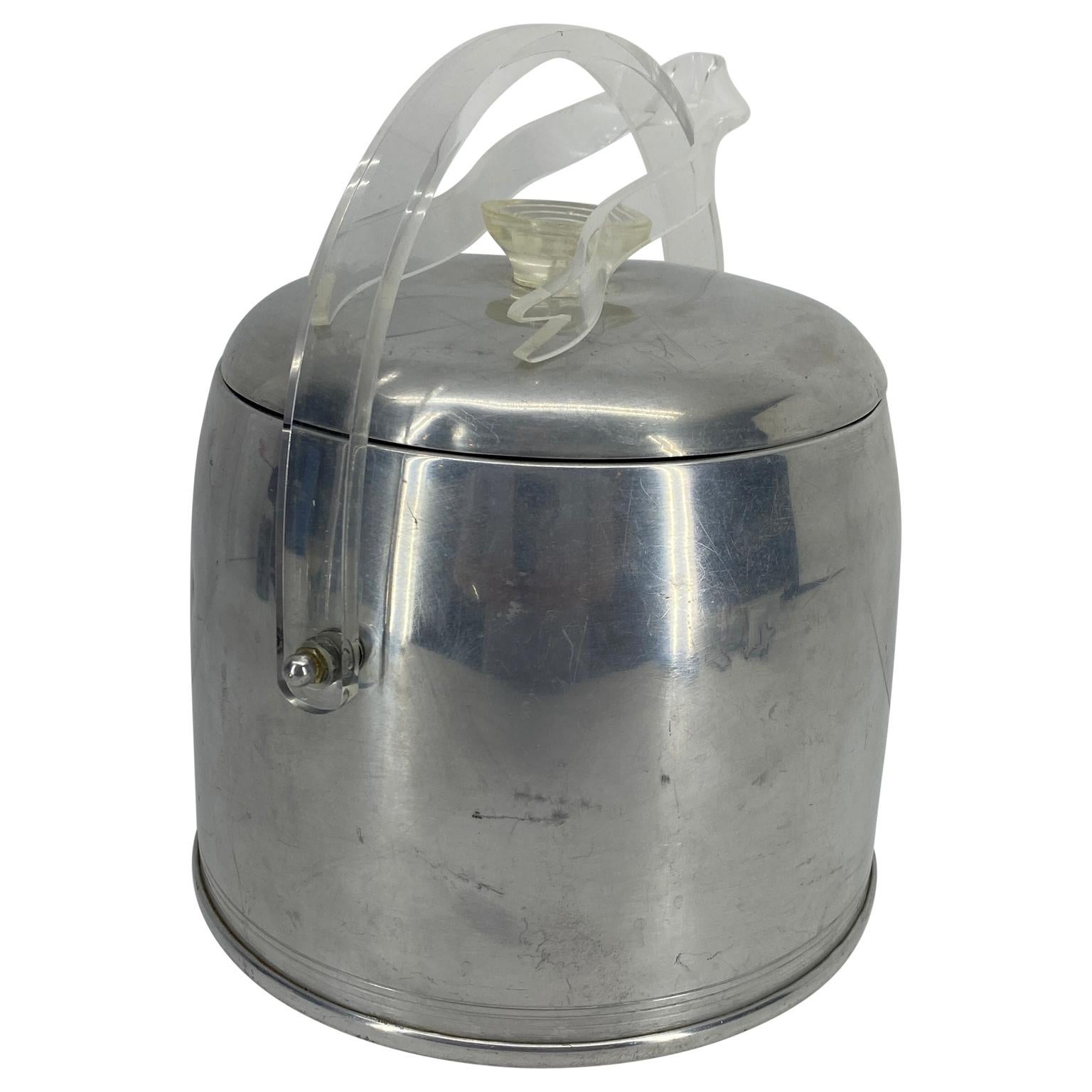 Vintage aluminum ice bucket and Lucite tongs.