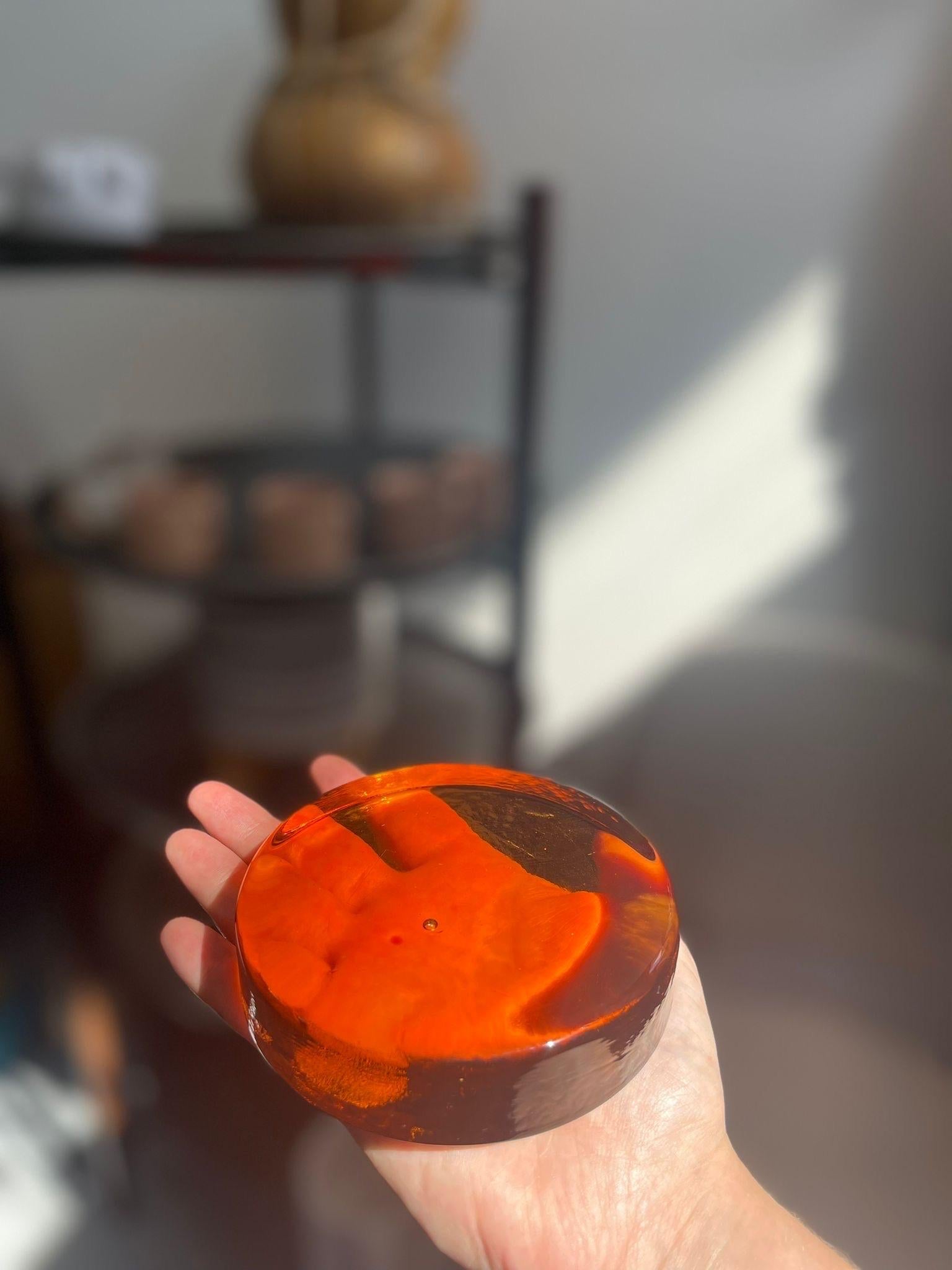 Vintage Paper Weight Amber or Mustard Colored . Mid Century Modern Table Decor. Possibly Glass Material 

Dimensions. 4 Dia ; 1 H