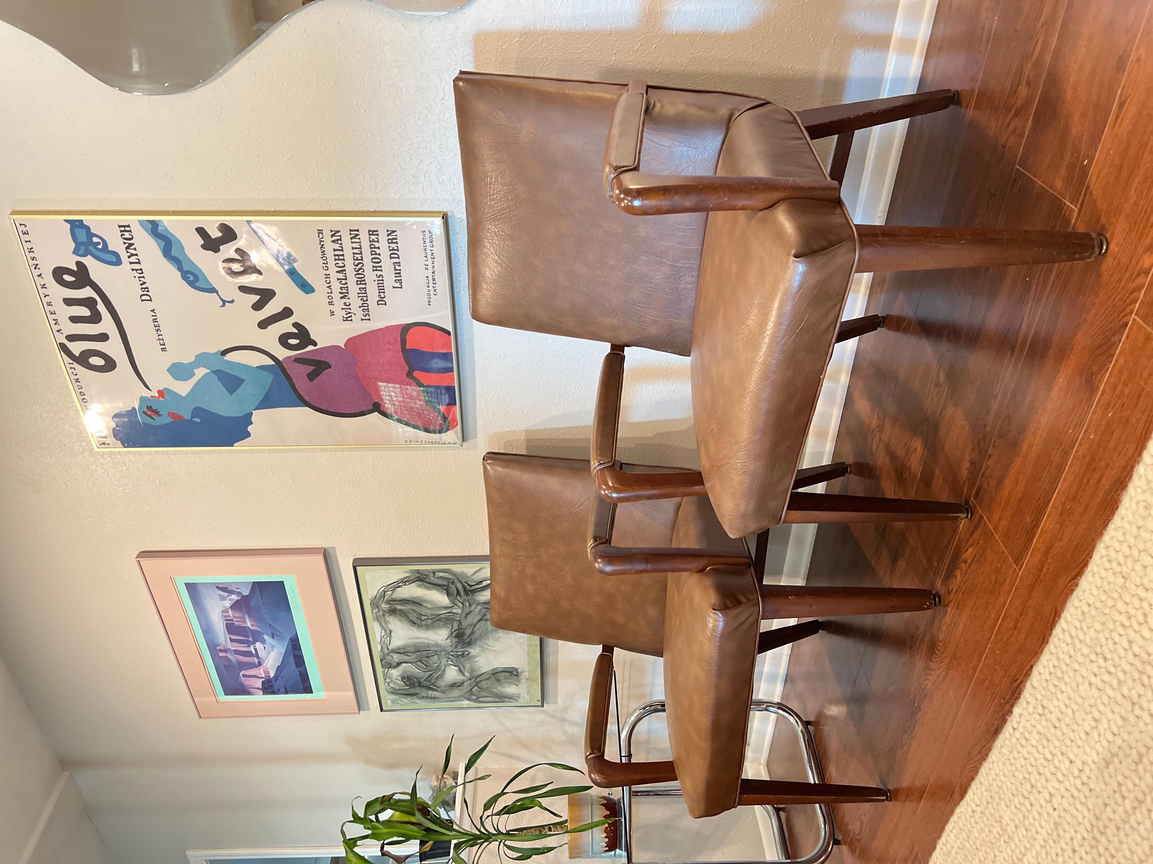 Comfort and design come together in these beautiful arm chairs in the style of Jens Risom. The leather is in excellent condition, and the frame has some minor flaws but also in very good condition. Both are structurally sound.