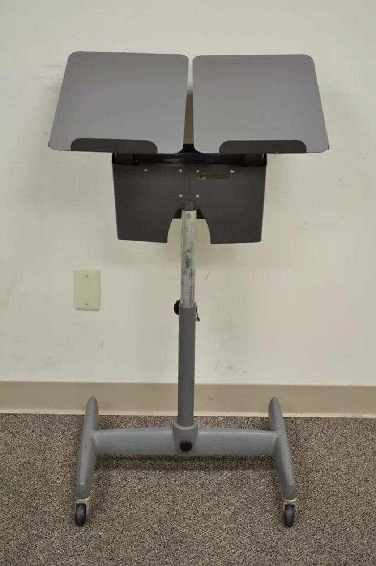 Vintage Mid Century Modern Art Deco Adjustable Book Lectern by Tiffany Stand Co. Item features a very unique spring/hydraulic like mechanism that balances the weight of the book on the book holder. The stand also adjusts up and down and the base has