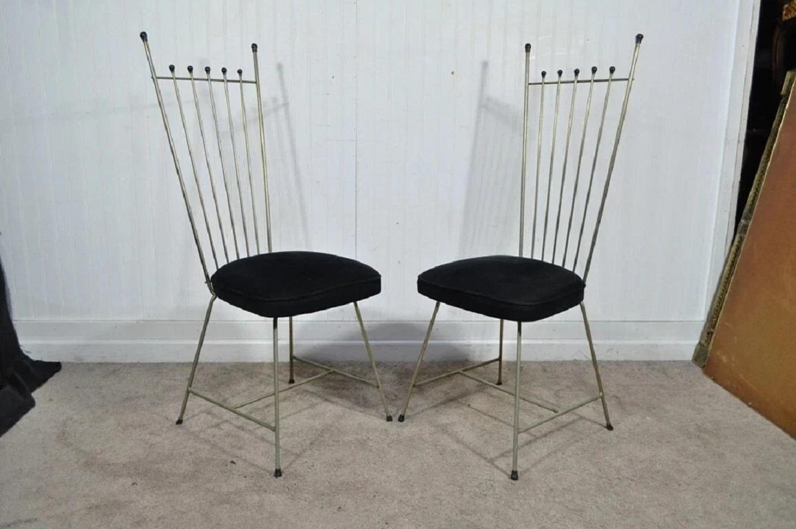 Vintage Mid Century Modern Arthur Umanoff Style Metal Dining Chairs - Set of 4. Item features metal frames in a silver tone with some areas of patina which adds character. Circa Mid 20th Century. Measurements: 40