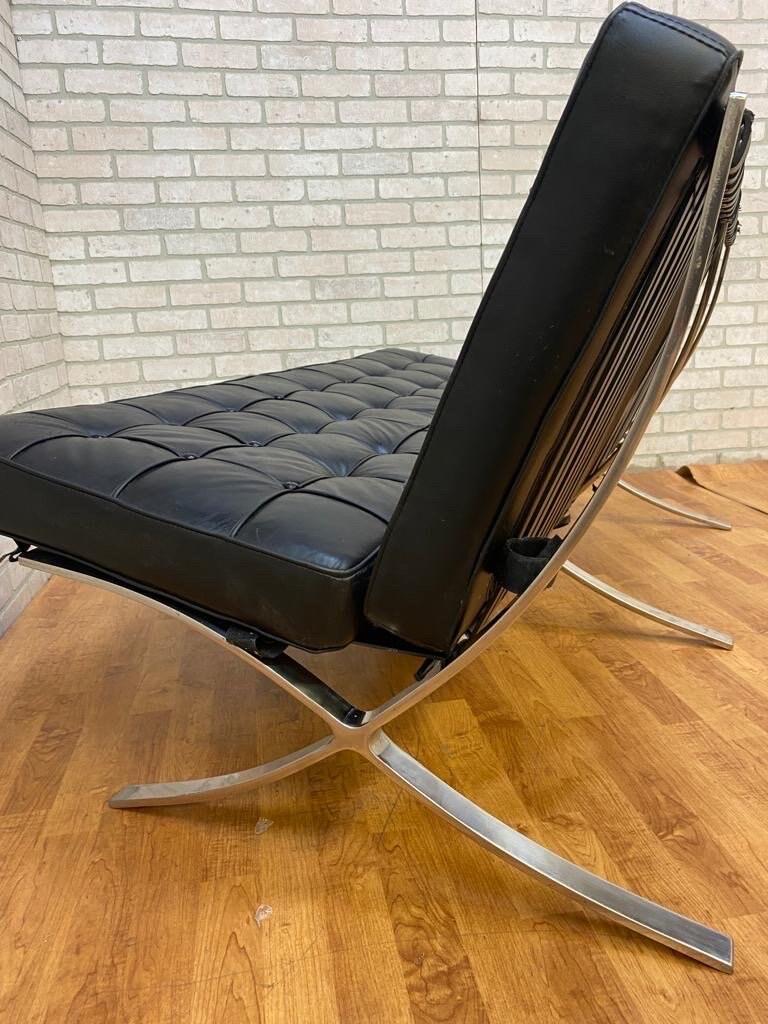 Vintage Mid Century Modern Barcelona Style Loveseat Sofa

Featuring MCM replica of the iconic Barcelona sofa designed by Mies Van Der Rohe and later manufactured by Knoll. The loveseat sofa has removable tufted black leatherette cushions and a
