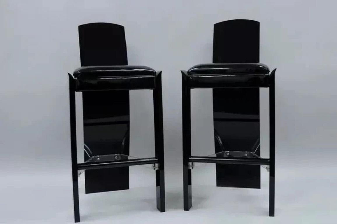 Vintage Mid Century Modern Black Lucite Sculptural Bar Stool Chairs by Hill - a Pair. Item features thick lucite construction, clear lucite stretcher supports, black metal footrests, black patent leather upholstered seats, sleek shapely form, and