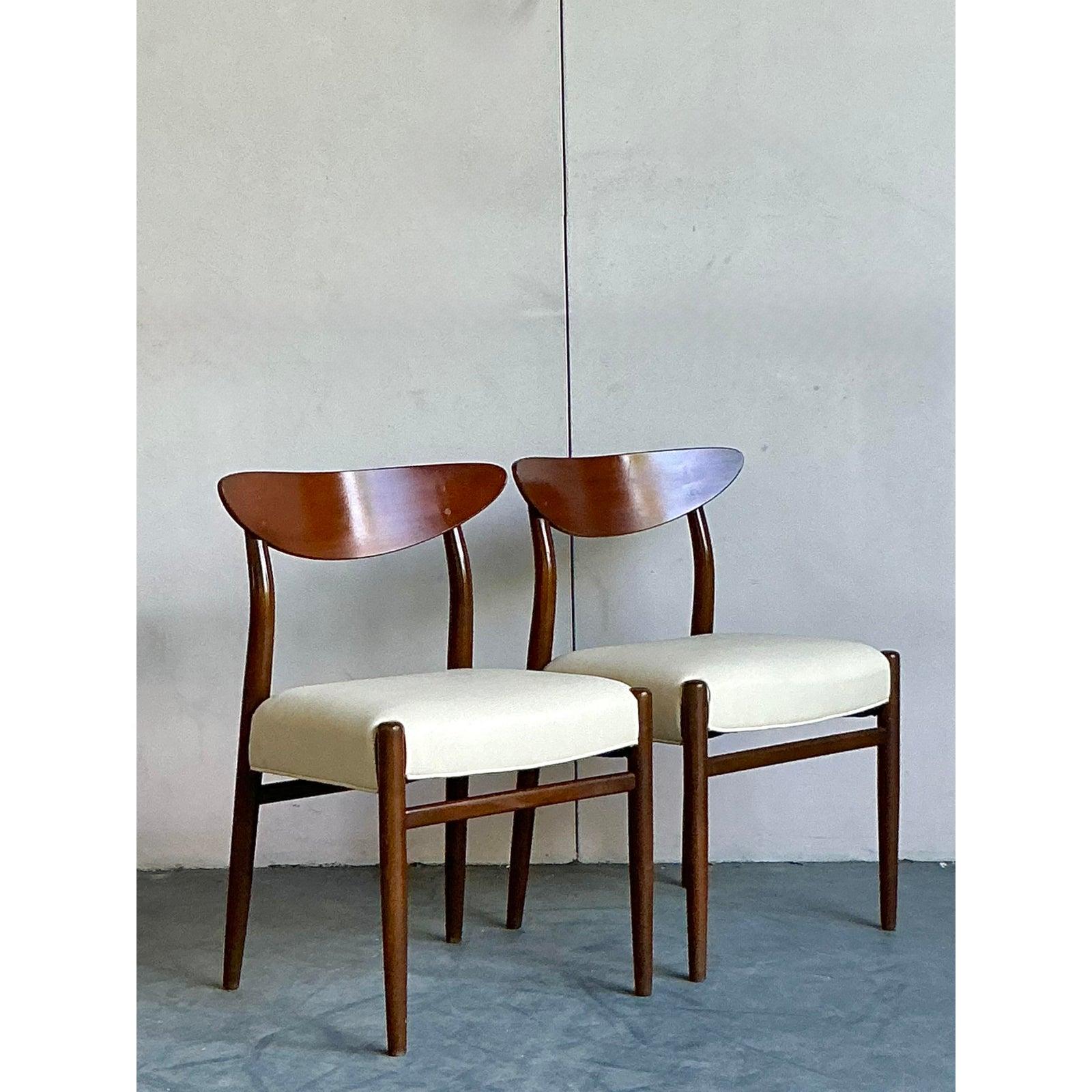 Capture the essence of Mid-Century Modern elegance with this stunning pair of vintage 