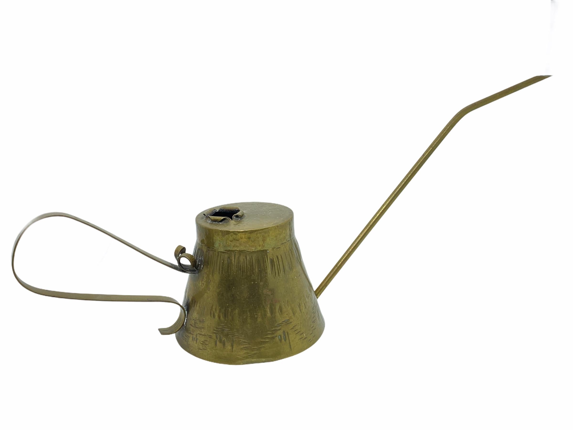 A gorgeous vintage Mid-Century Modern brass watering can with a long spout. Great lines, great original condition with wonderful patina.
