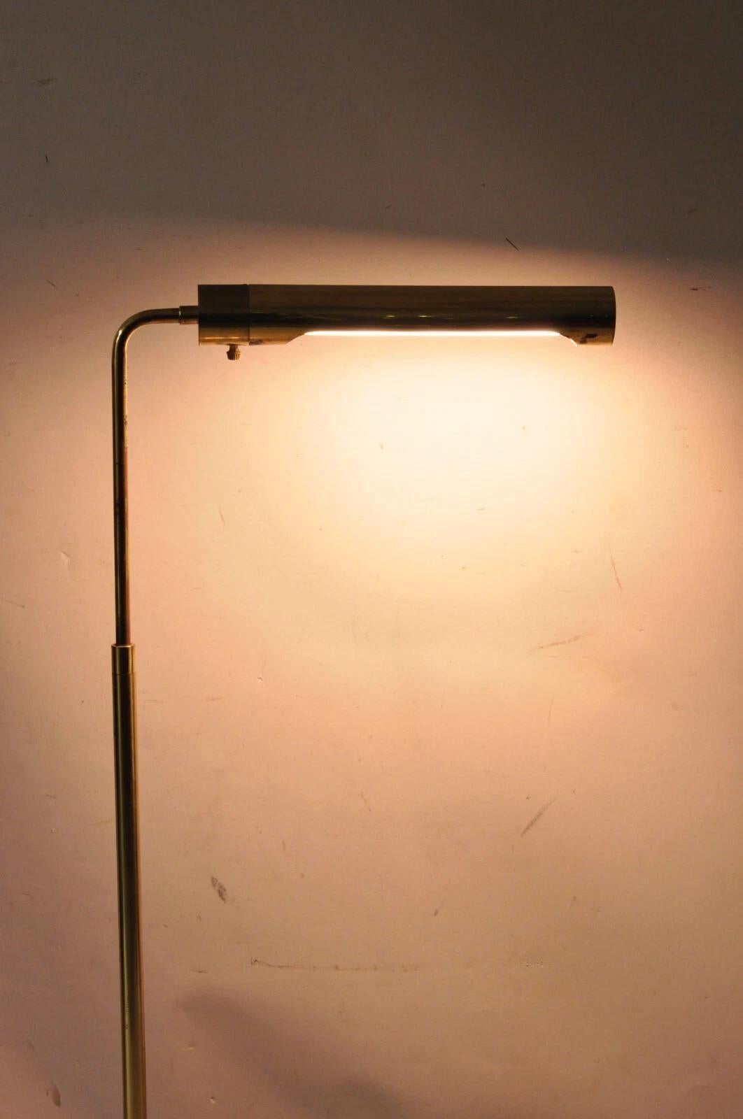 Vintage Mid Century Modern Brass Casella Style Adjustable Height Tubular Floor Lamp. Circa Late 20th Century. Dimensions : 43-33