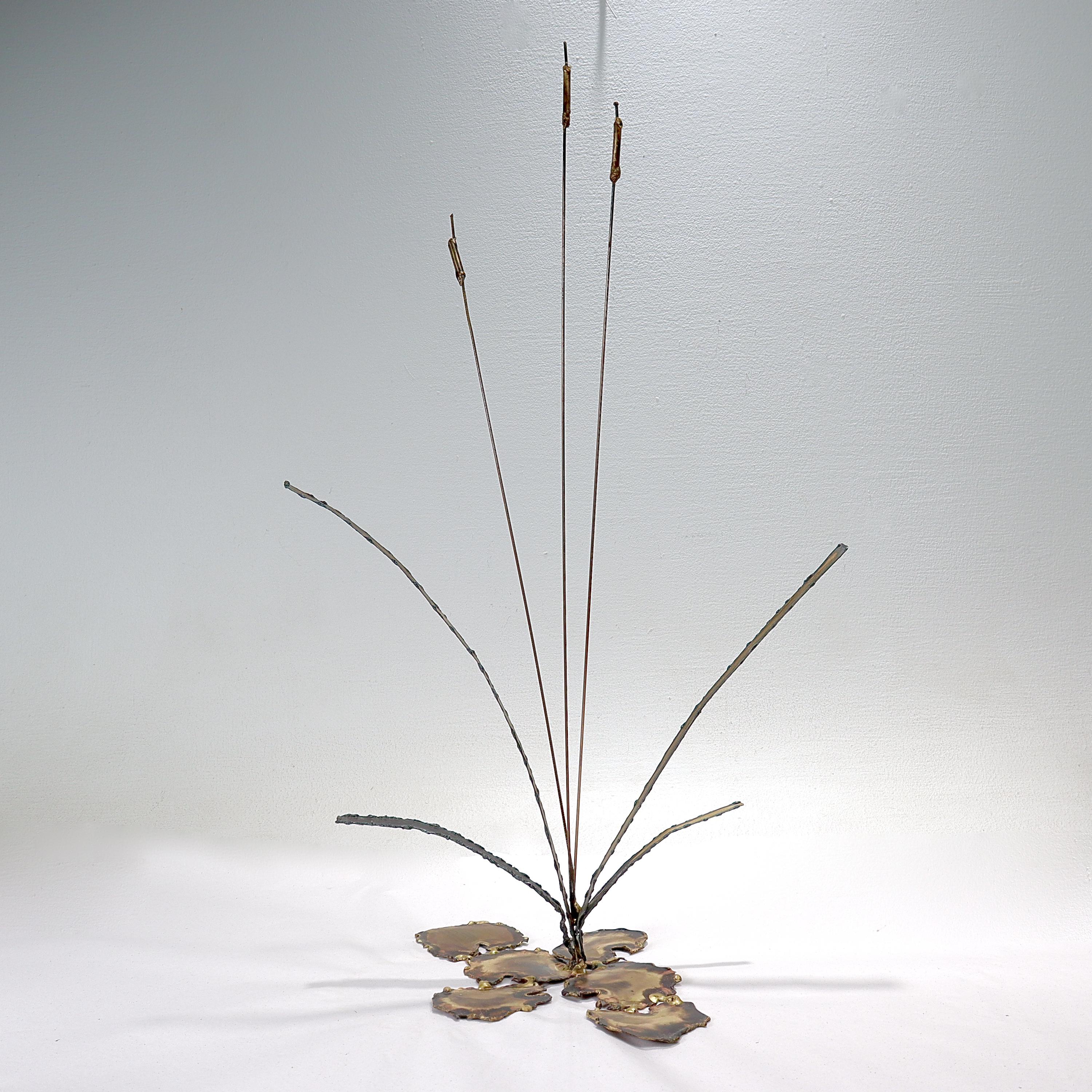 A fine vintage Mid-Century Modern mixed metals sculpture.

In the style of Curtis Jere.

In soldered brass & copper. 

In the form of cattails surrounded by lilypads(?).

Simply a great Mid-Century Modern sculpture!

Date:
Mid-20th