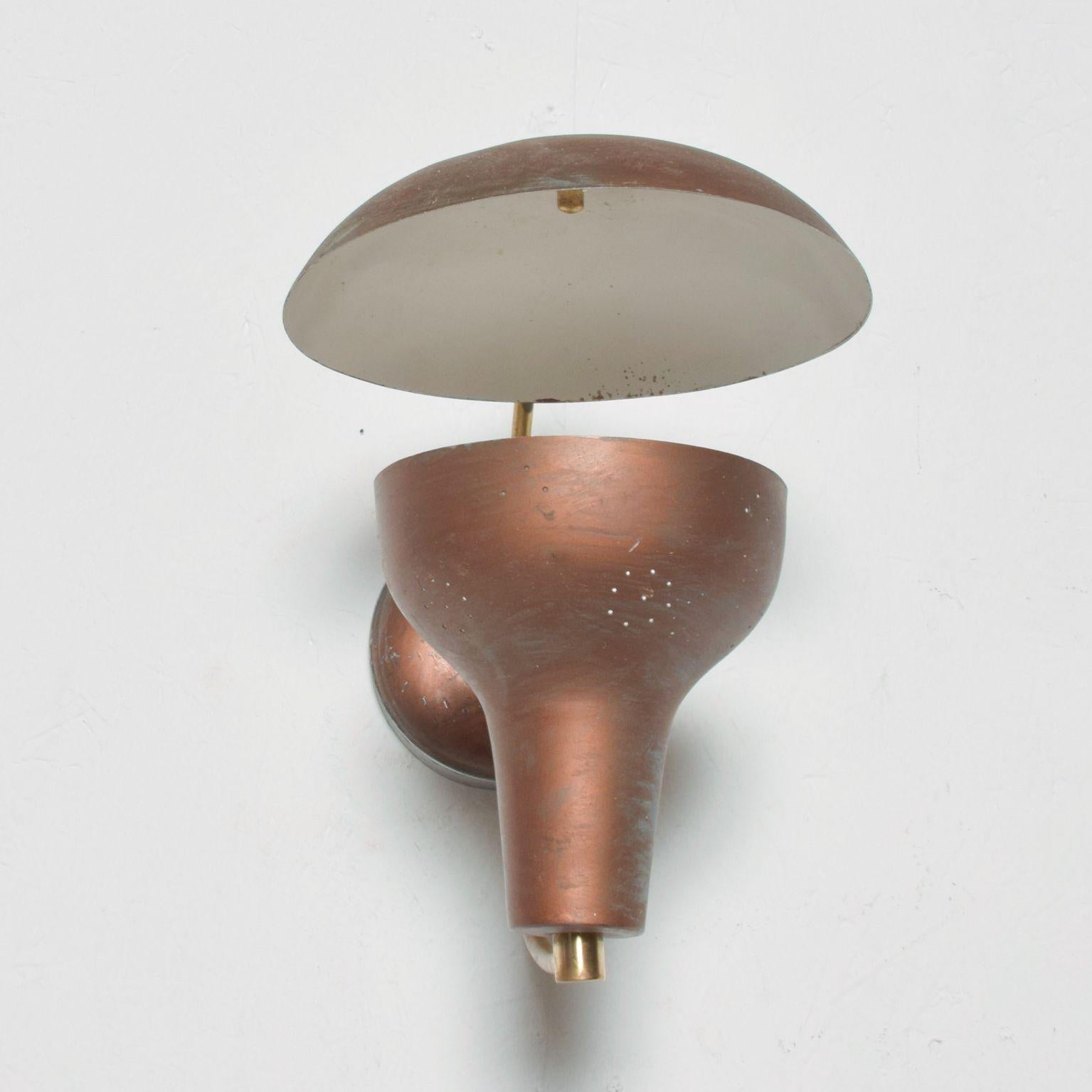 Wall Sconce
Vintage Mid Century Modern Single Brass Wall Sconce in Brown 1950s
Crafted in aluminum and brass.
Please note condition is vintage presents unrestored preowned with visible wear and use. 
Consult images
Dimensions: 10.5H x 8W x 12 D