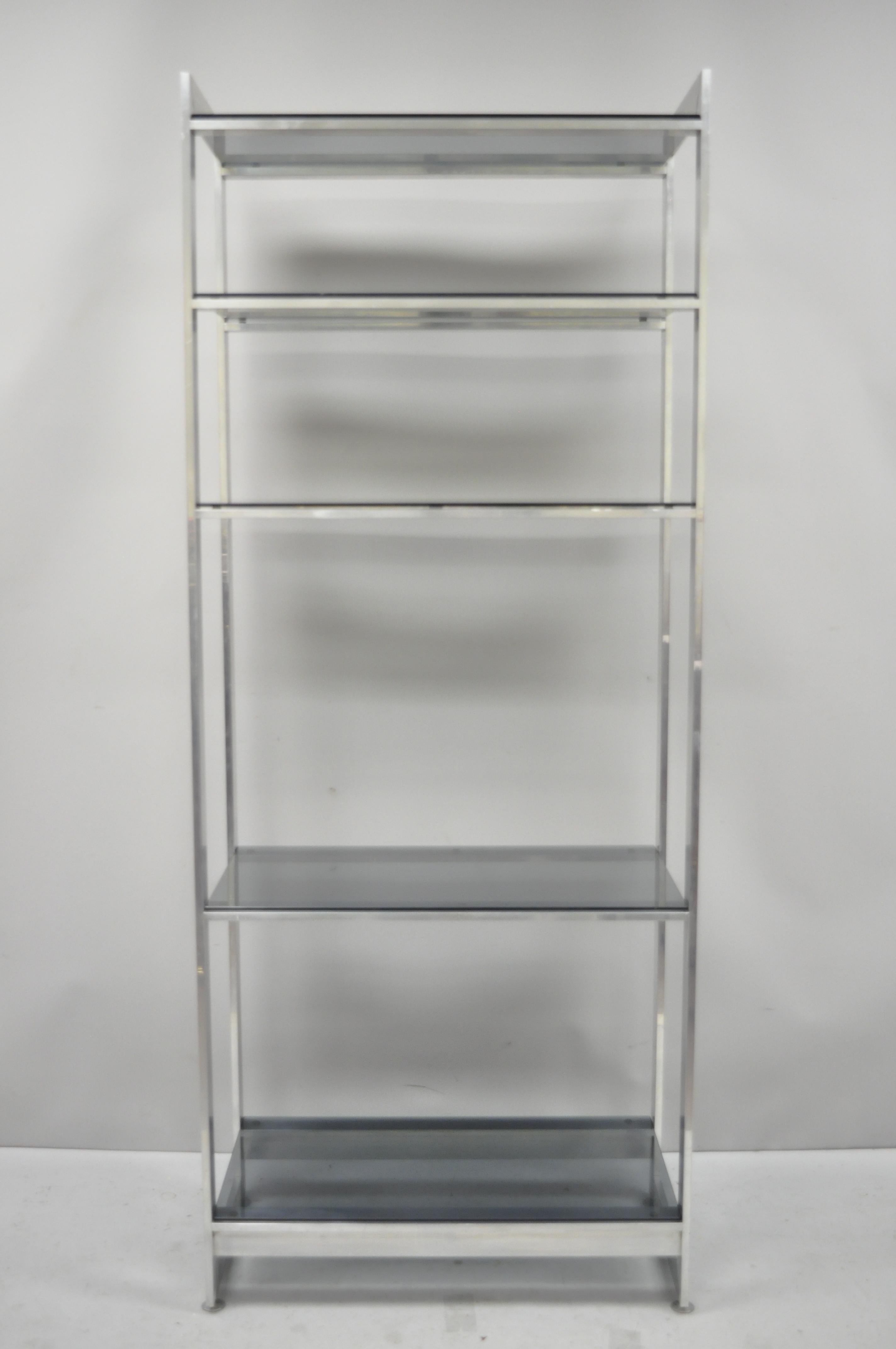 Vintage Mid-Century Modern brushed aluminum chrome frame étagère display shelf. Item features brushed aluminum metal frame, 5 smoked glass shelves, clean modernist lines, circa mid-20th century. Measurements: 74.5