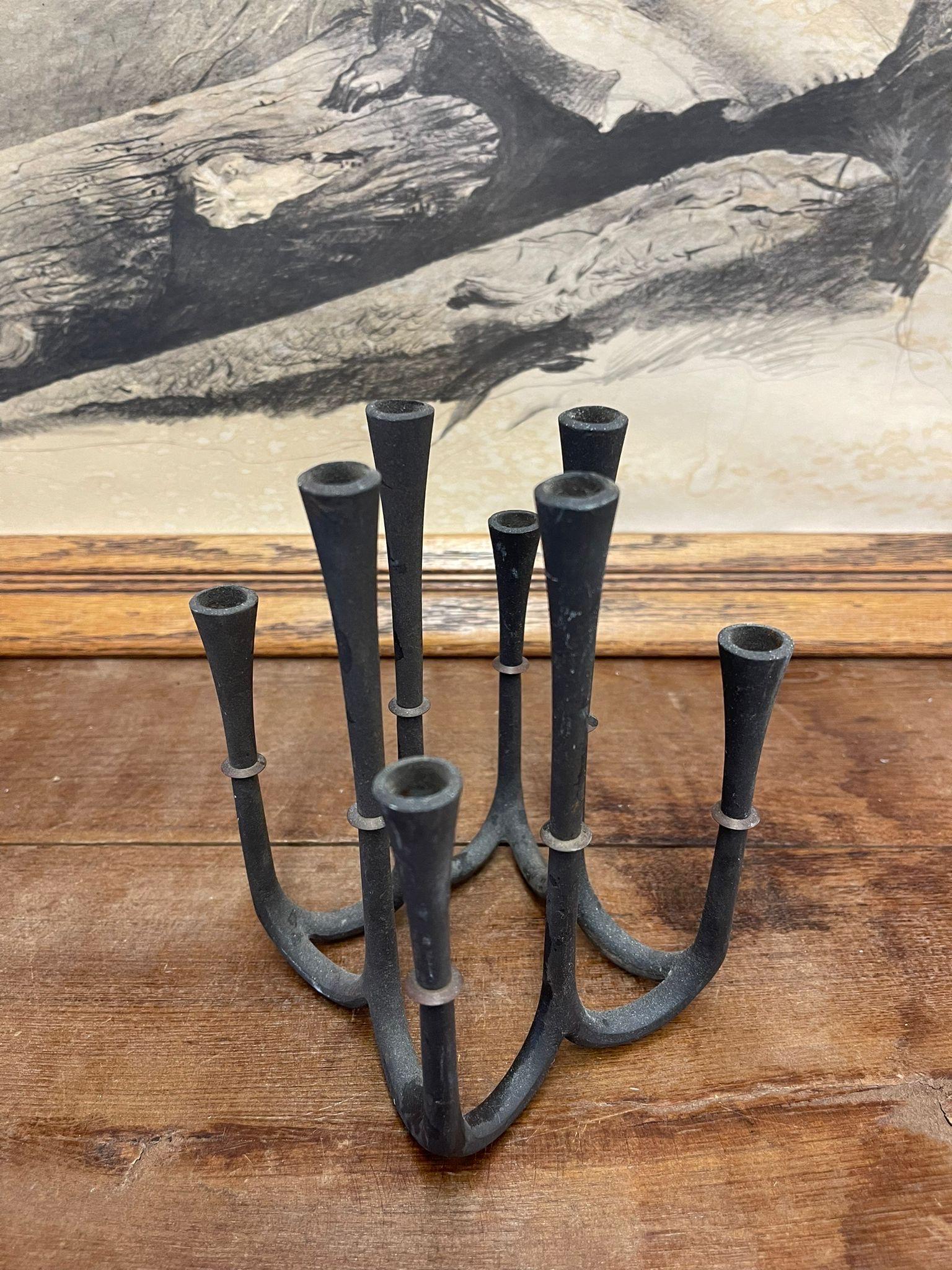 Eight Arm Candle Holder. Brutalist Design. Possibly Cast Iron . Vintage Condition Consistent with Age as Pictured.

Dimensions. 5 1/2 W ; 5 1/2 D ; 6 3/4 D
