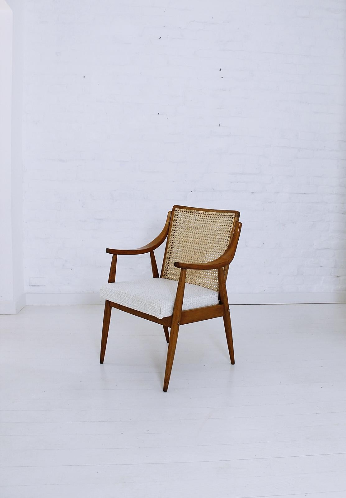 Rare Mid-Century Modern Hungarian armchair in style of Peter Hvidt and Orla Mølgaard-Nielsen, in very good condition.
This chair in beechwood with double caned back is newly upholstered.