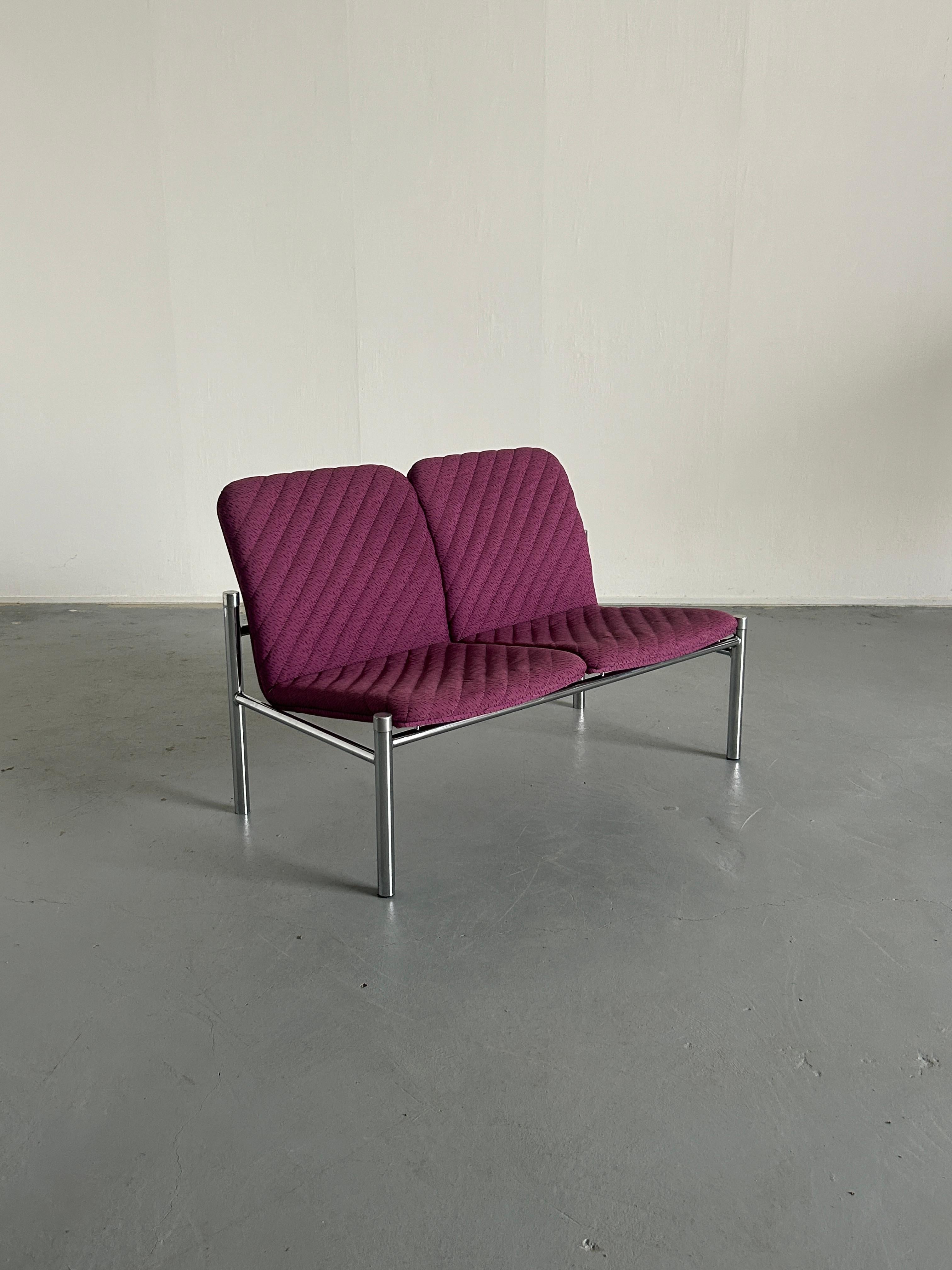A Mid-Century Modern vintage loveseat sofa in purple upholstery and chrome metal base, designed and produced by Wiesner Hager in Austria, 1980s.

Labeled.

Very good vintage condition with smaller expected signs of age. 
Structurally