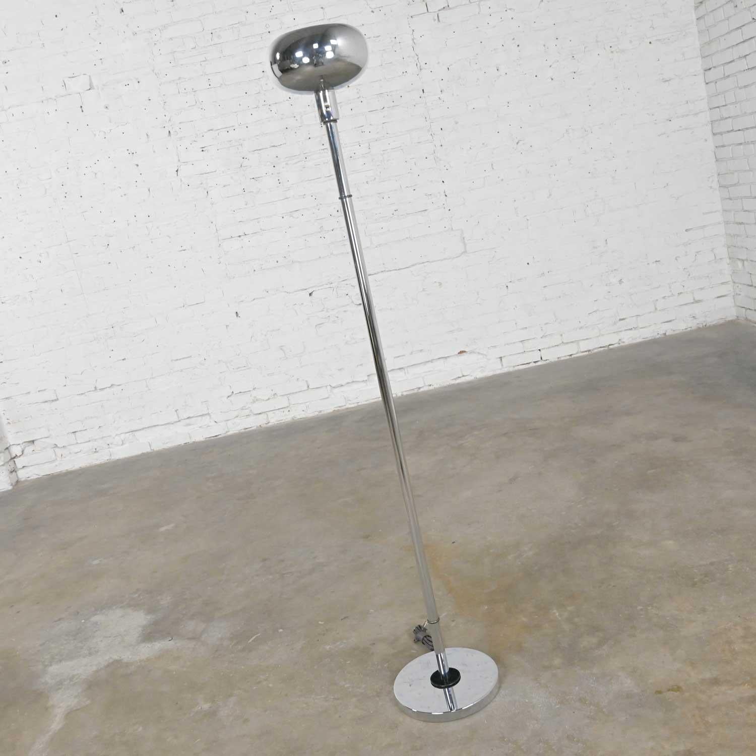 Awesome vintage Mid-Century Modern chrome torchier floor lamp with a brass switch, new chrome socket and cord, and black painted rings and details. Beautiful condition, keeping in mind that this is vintage and not new so will have signs of use and