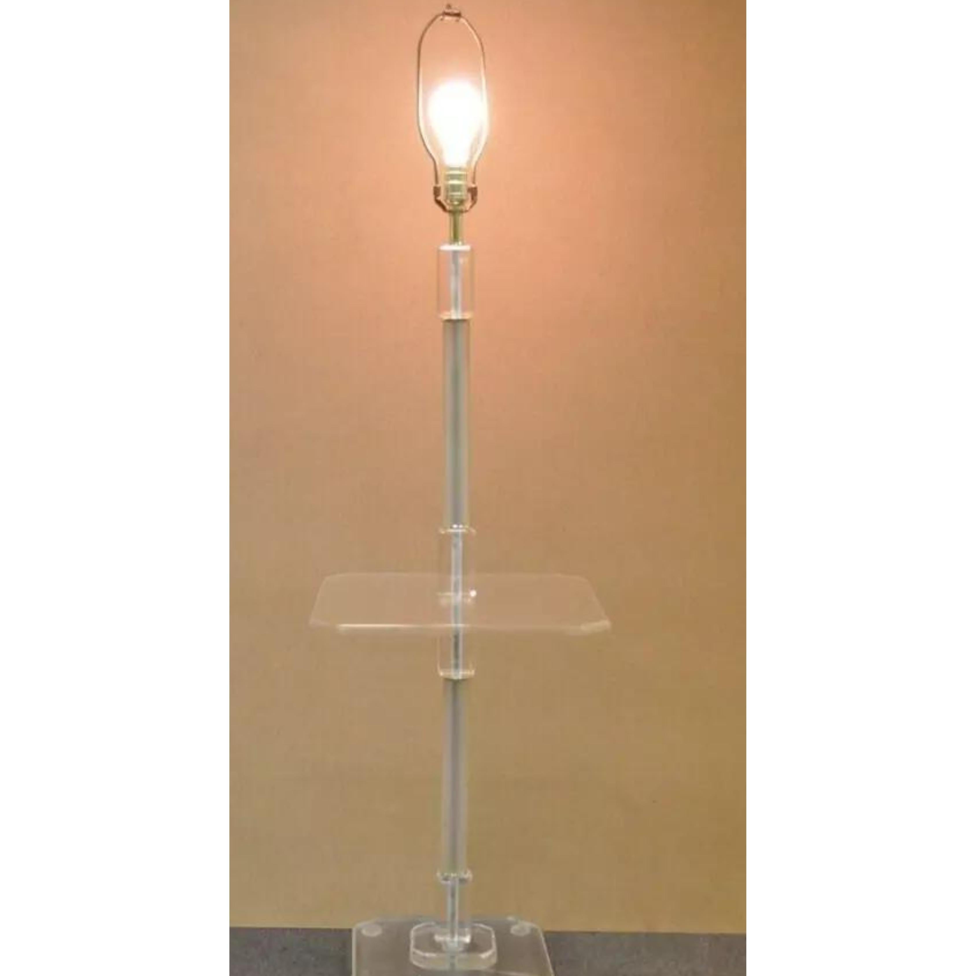 Vintage Mid Century Modern Clear Lucite Occasional Accent Floor Lamp Side Table. Item features a substantial lucite base and table surface with frosted lucite column. Wired for use with a 3-way bulb. Circa Mid 20th Century. Measurements: 55.5