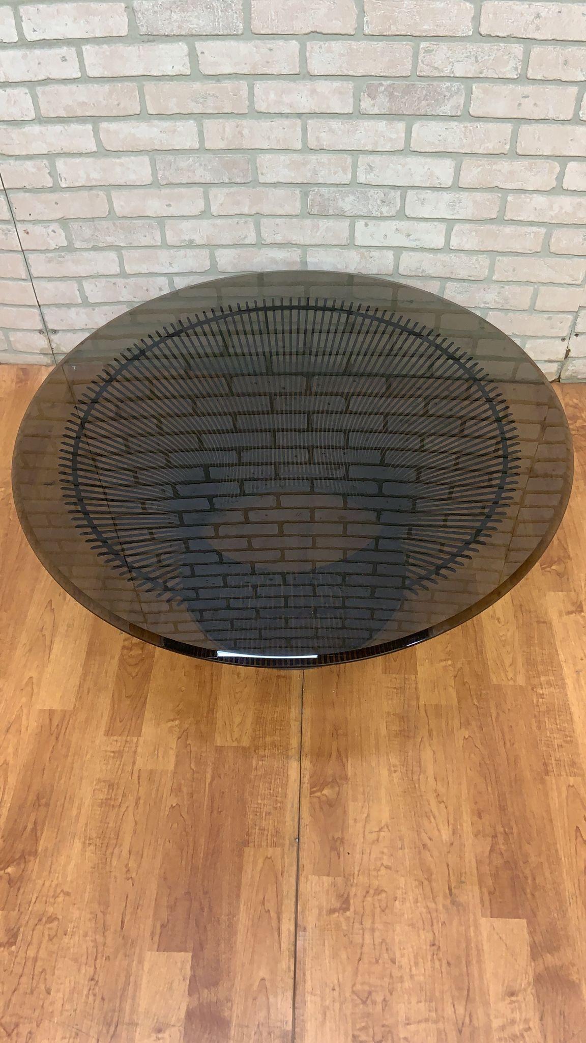 Vintage Mid Century Modern Coffee Table by Warren Platner for Knoll

An iconic classic mid century modern circular cocktail table designed by Warren Platner for Knoll. It features a dark bronze wire base with tinted glass top. Original design,